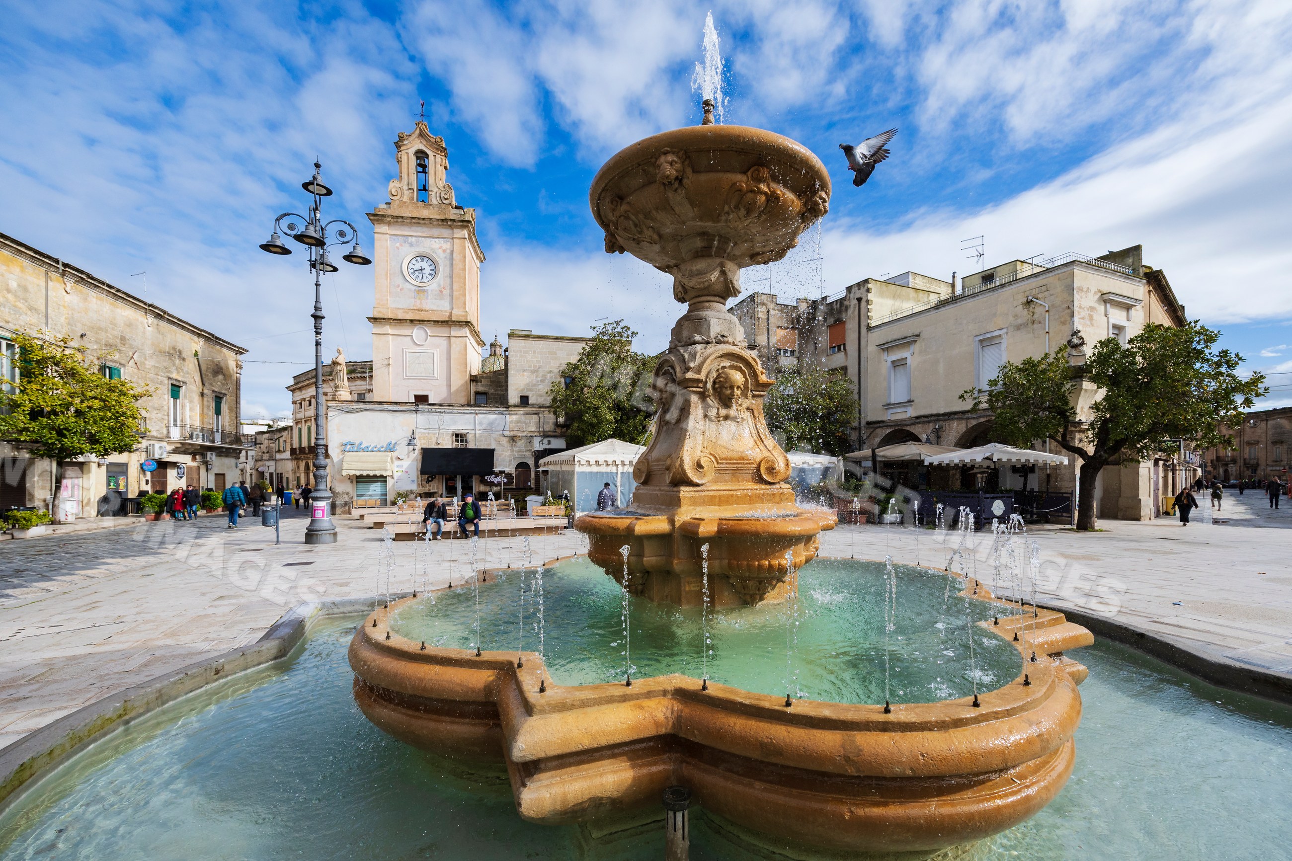 Fountain and clock tower in Piazza Umberto in francavilla fontana