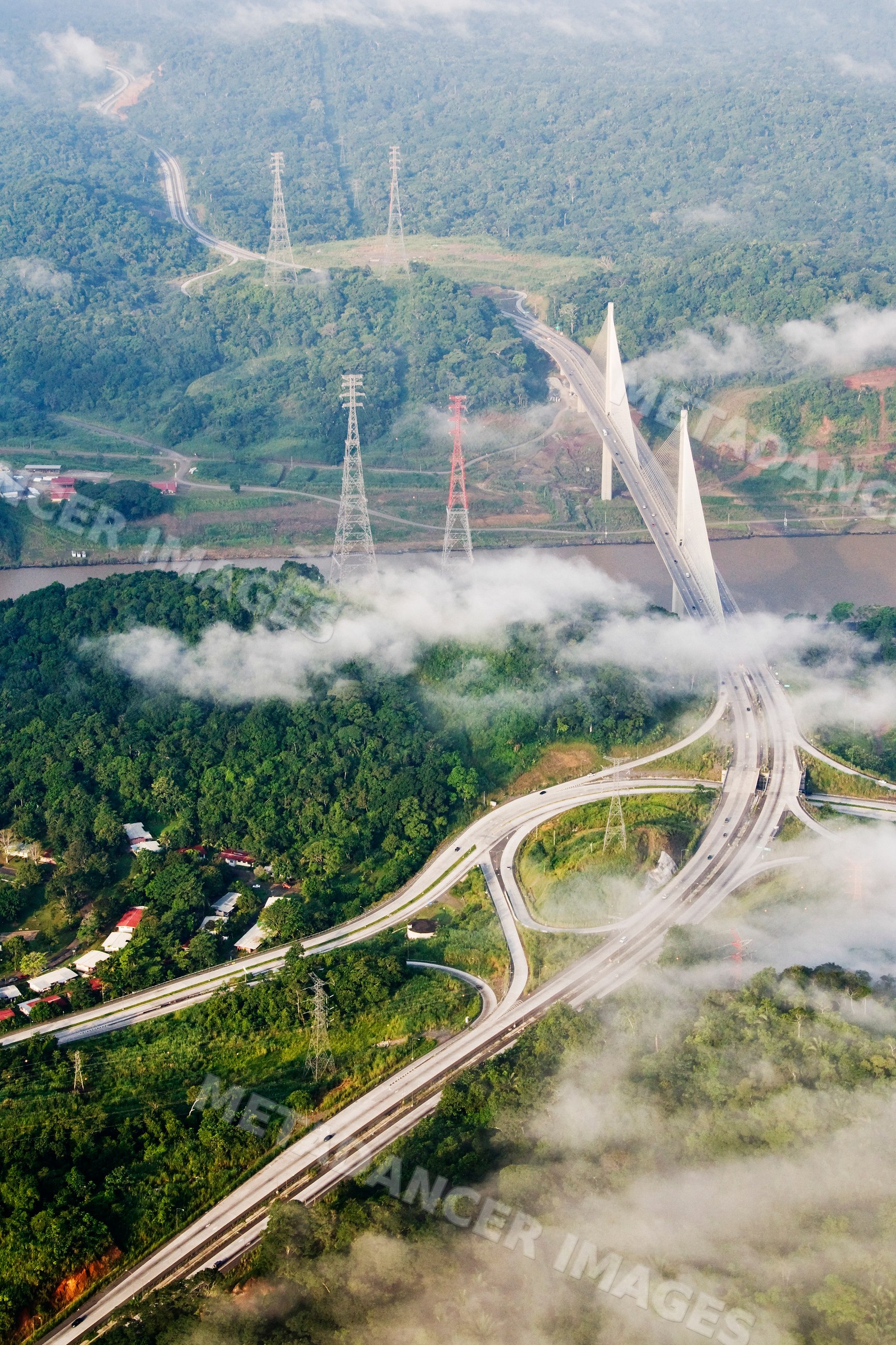 New millennium panama canal bridge over river with surrounding forest
