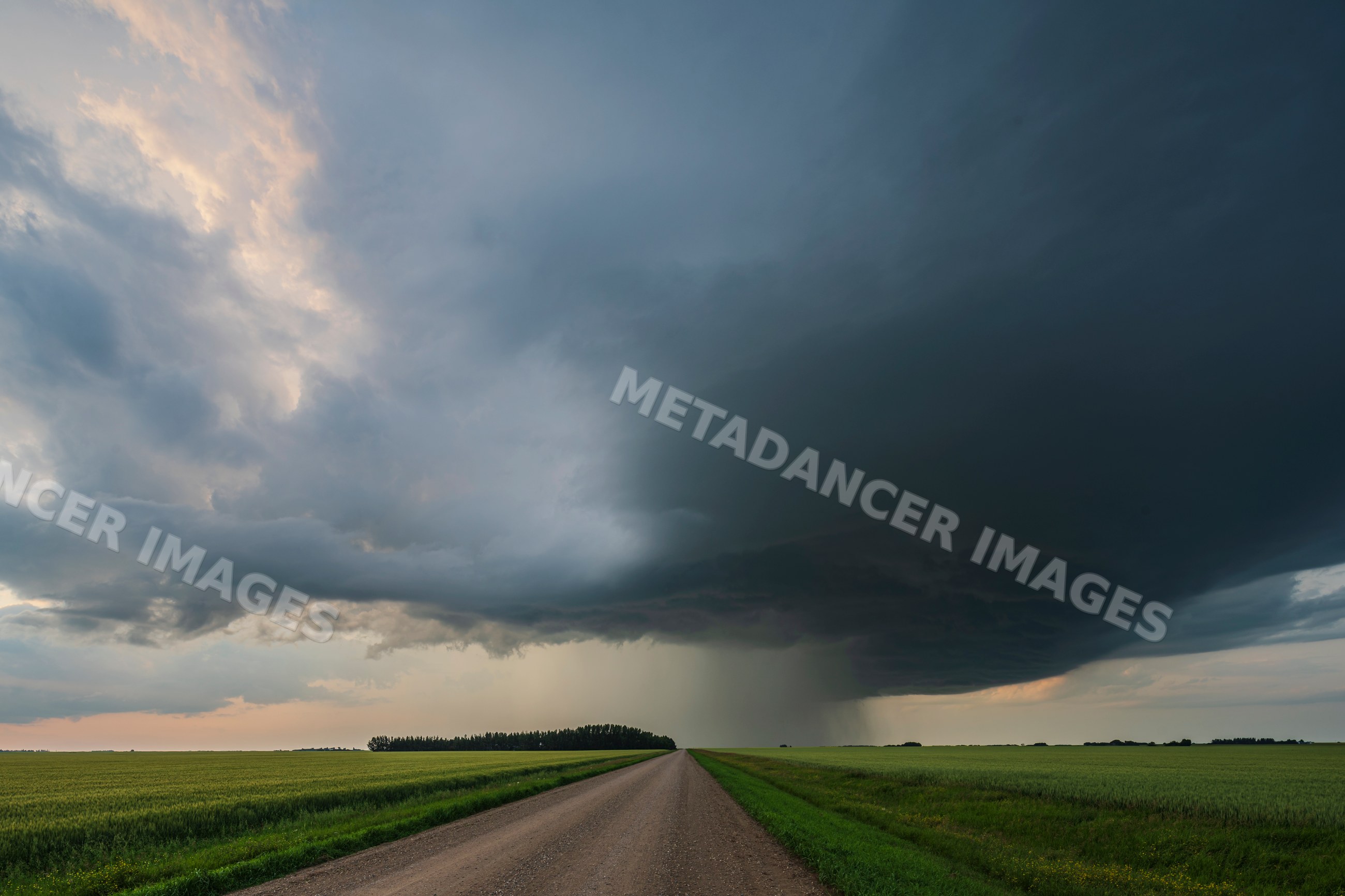 Storm supercell with low precipitation clouds over farmland