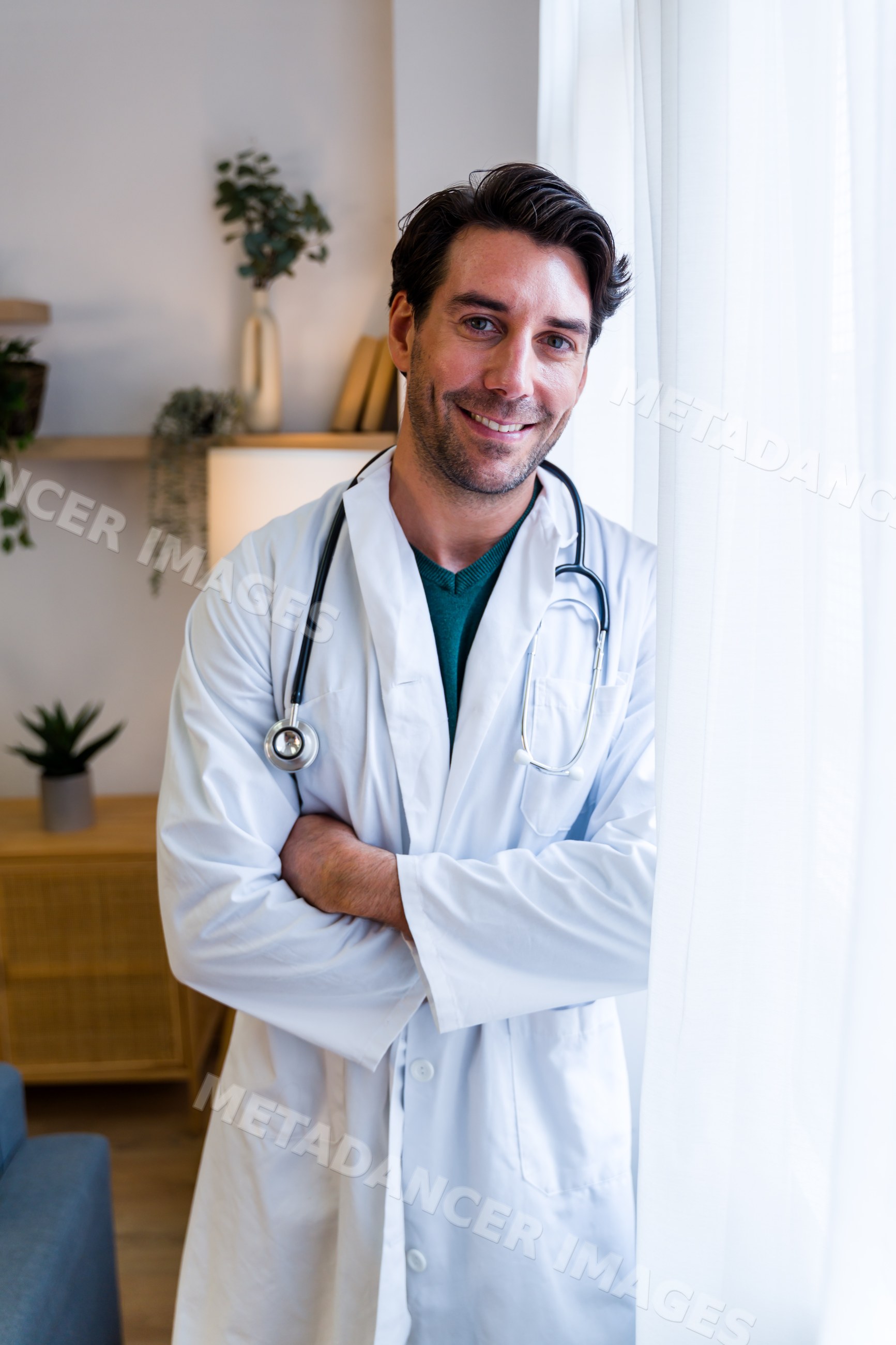Male doctor smiling confidently in a modern medical office