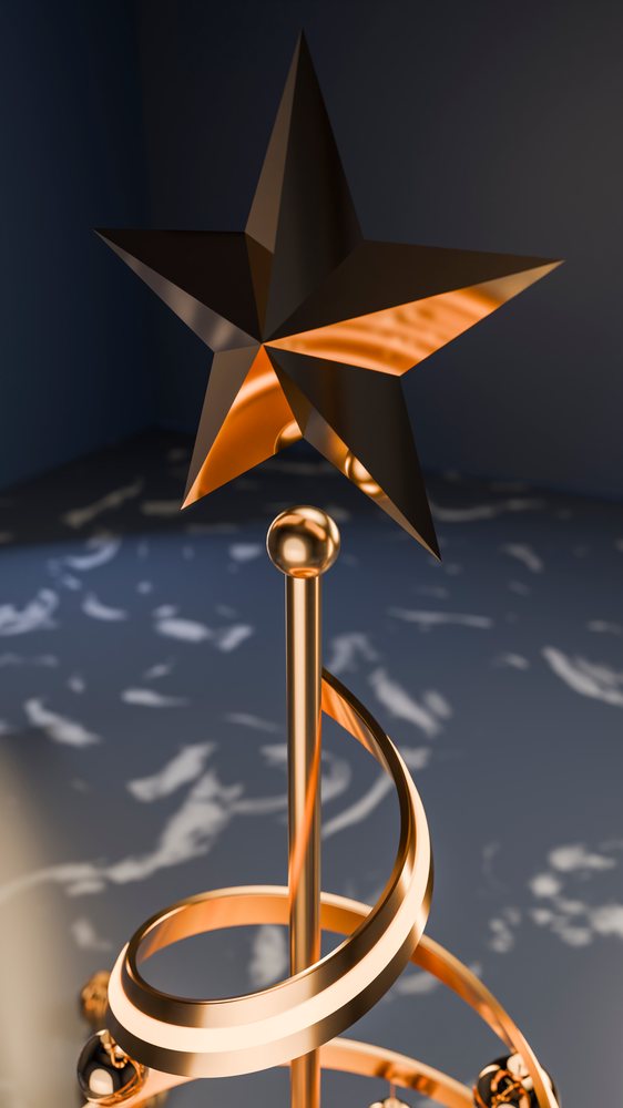 Metal star topper with spiral gold decoration