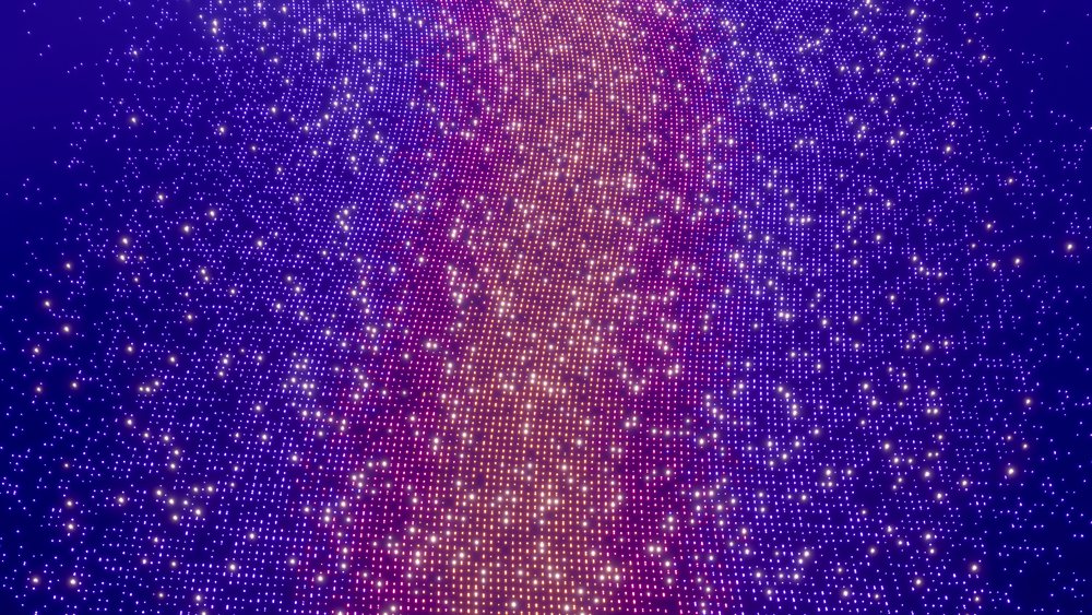 Digital illustration of glowing particles forming colorful wave