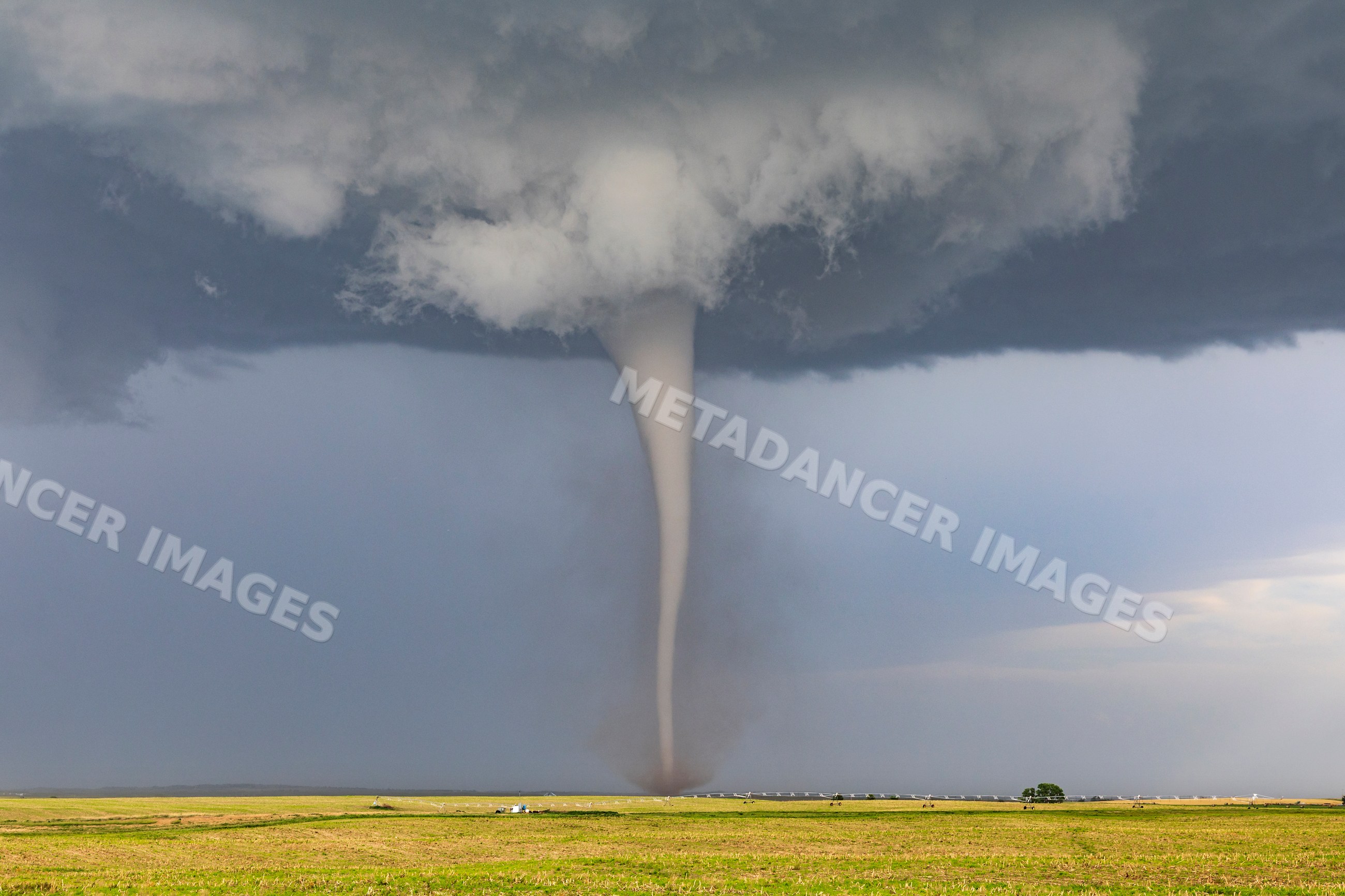 Tornado funnel descending over field near dickens nebraska