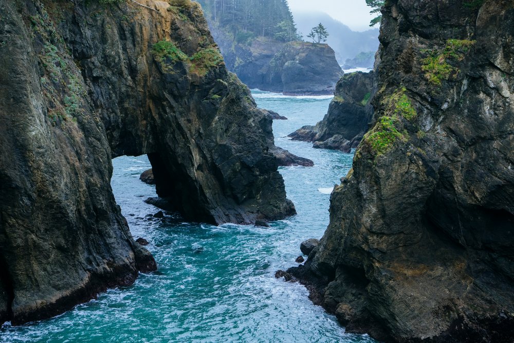 Sea arch and rock formations along ocean cliffs Oregon