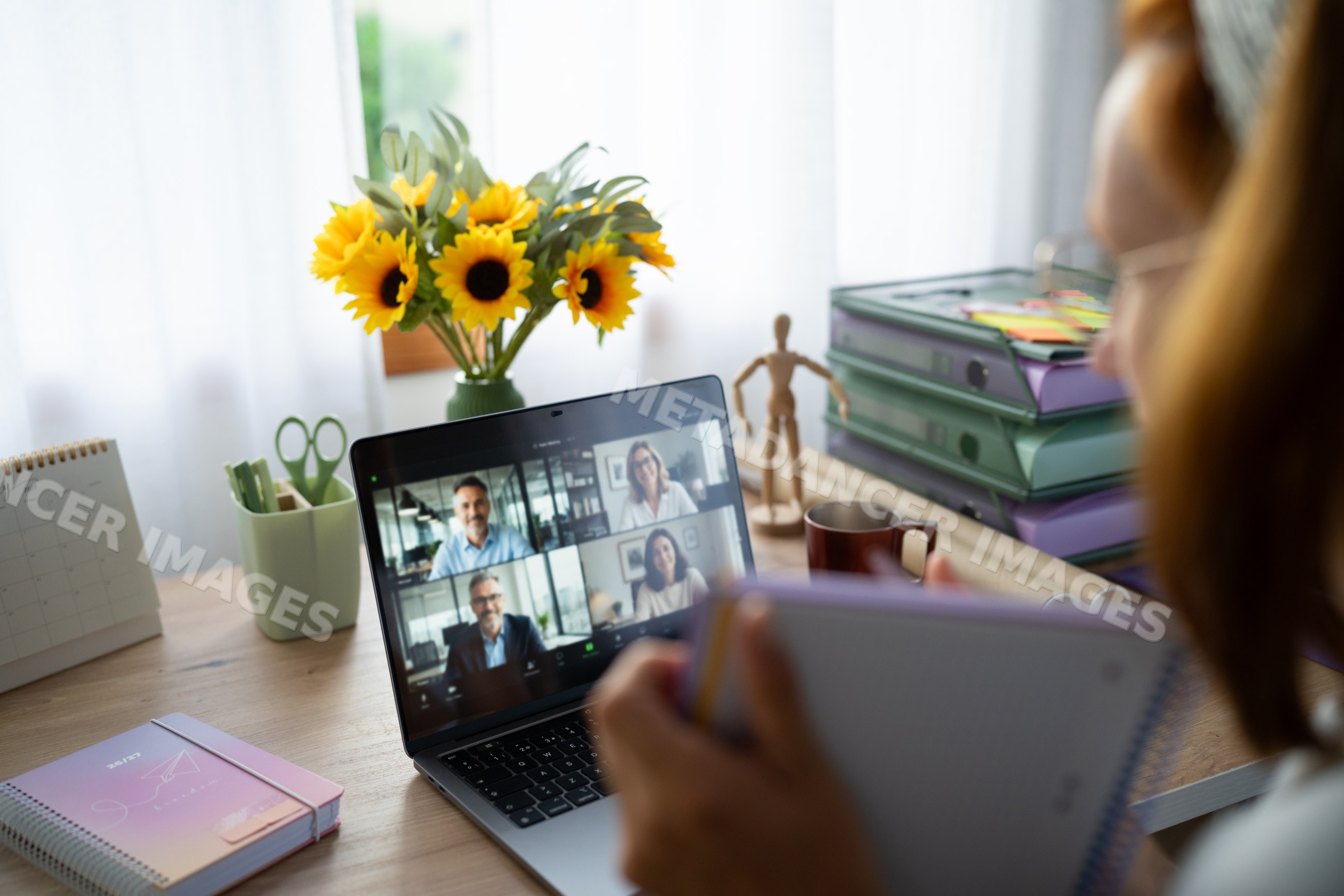 White Person attending a remote video call