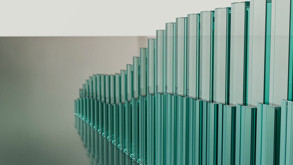 Row of teal-tinted glass panels in modern architecture