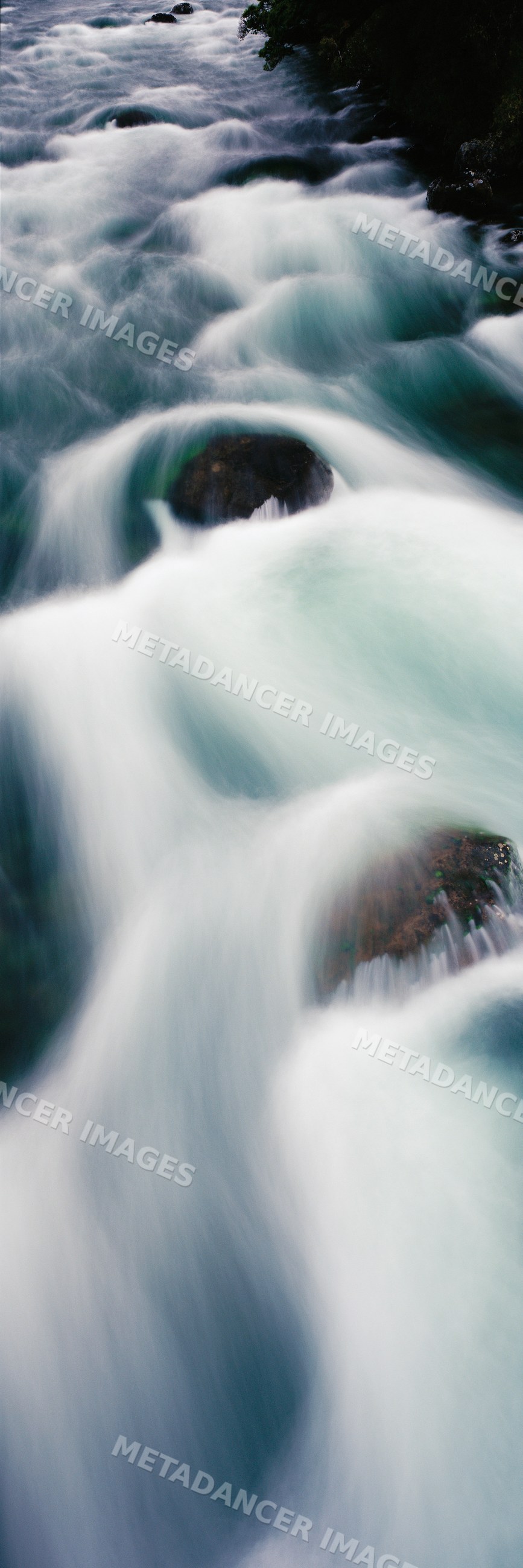 Buller river flowing over rocks in motion with long exposure