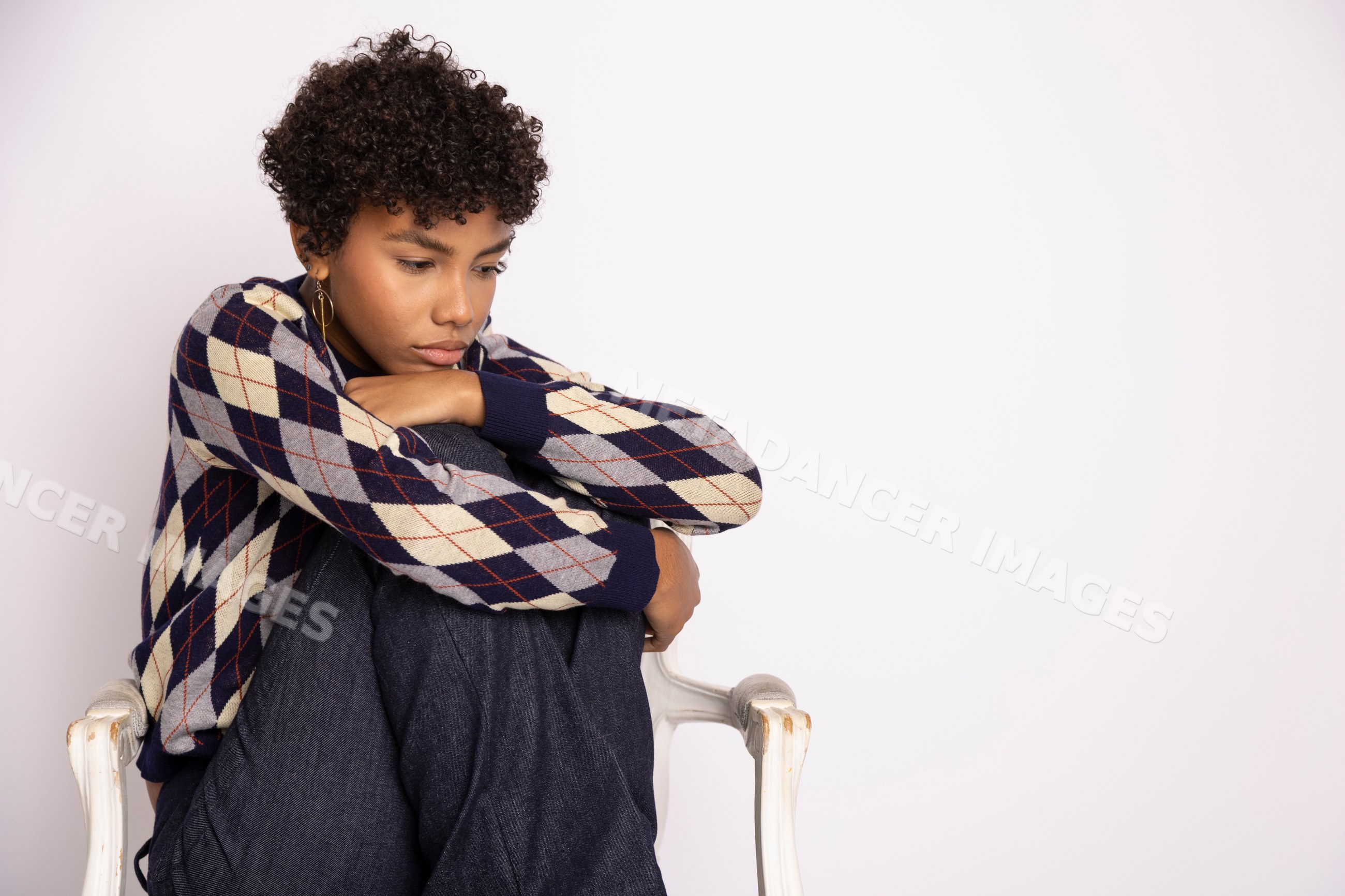 Young Hispanic woman in navy, cream
