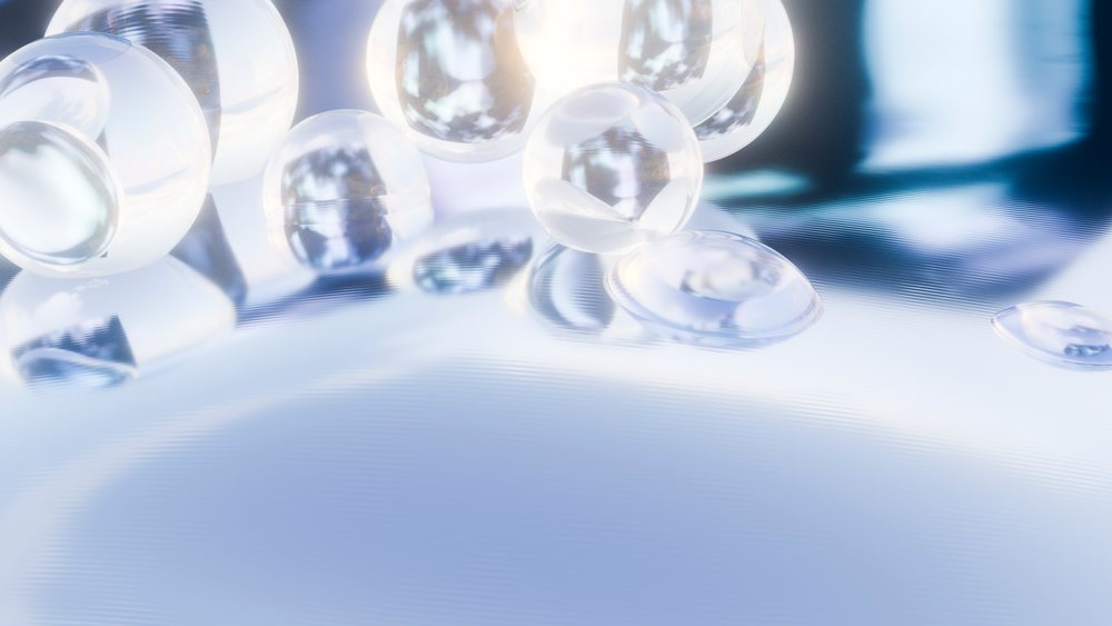 Transparent bubbles on water surface reflecting light