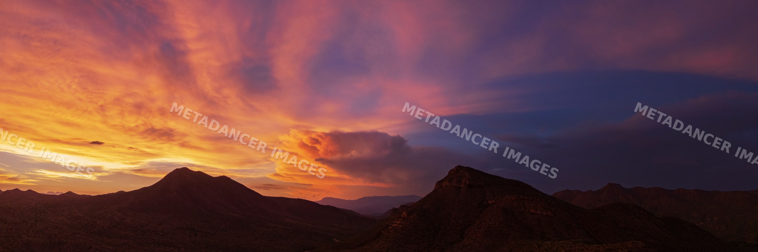 Storm clouds gathering over mountains at Sunset in arizona