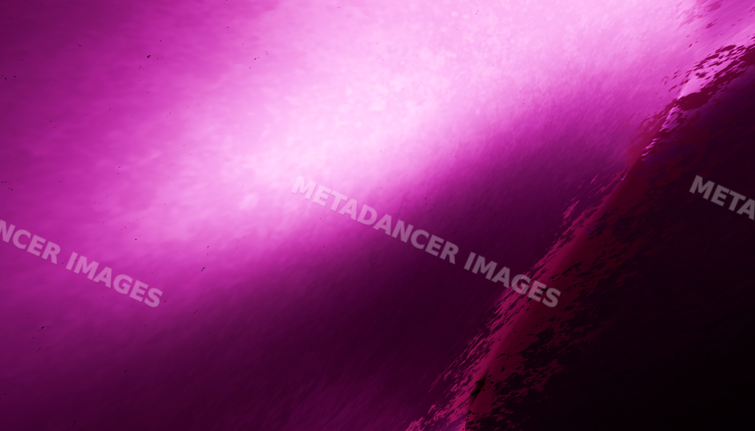 Close-up of a purple ocean wave curling with textured water surface