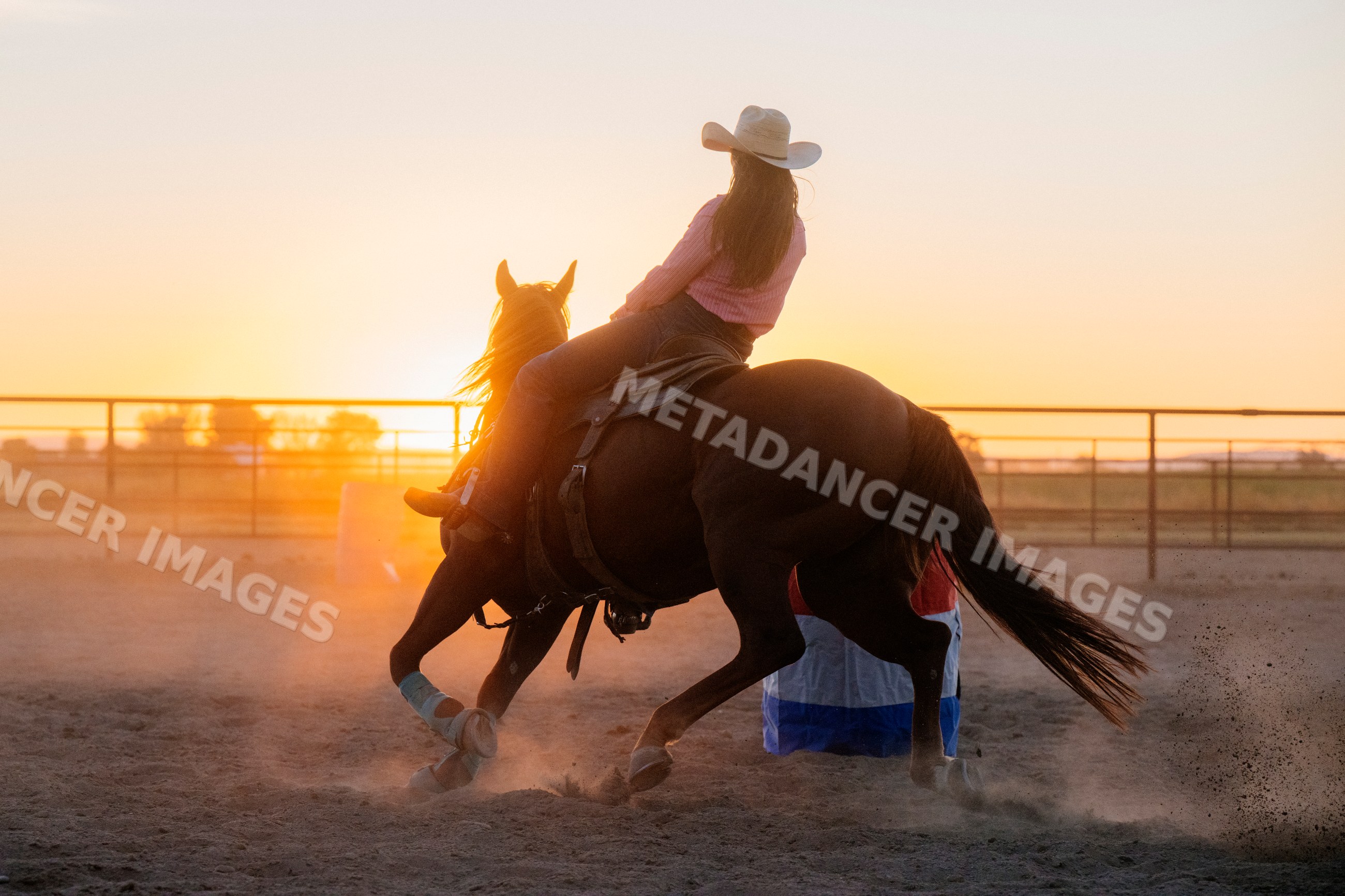 Horseback rider performing western riding at sunset in Southwest USA