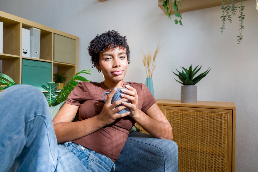 Young African American woman relaxing with a cup