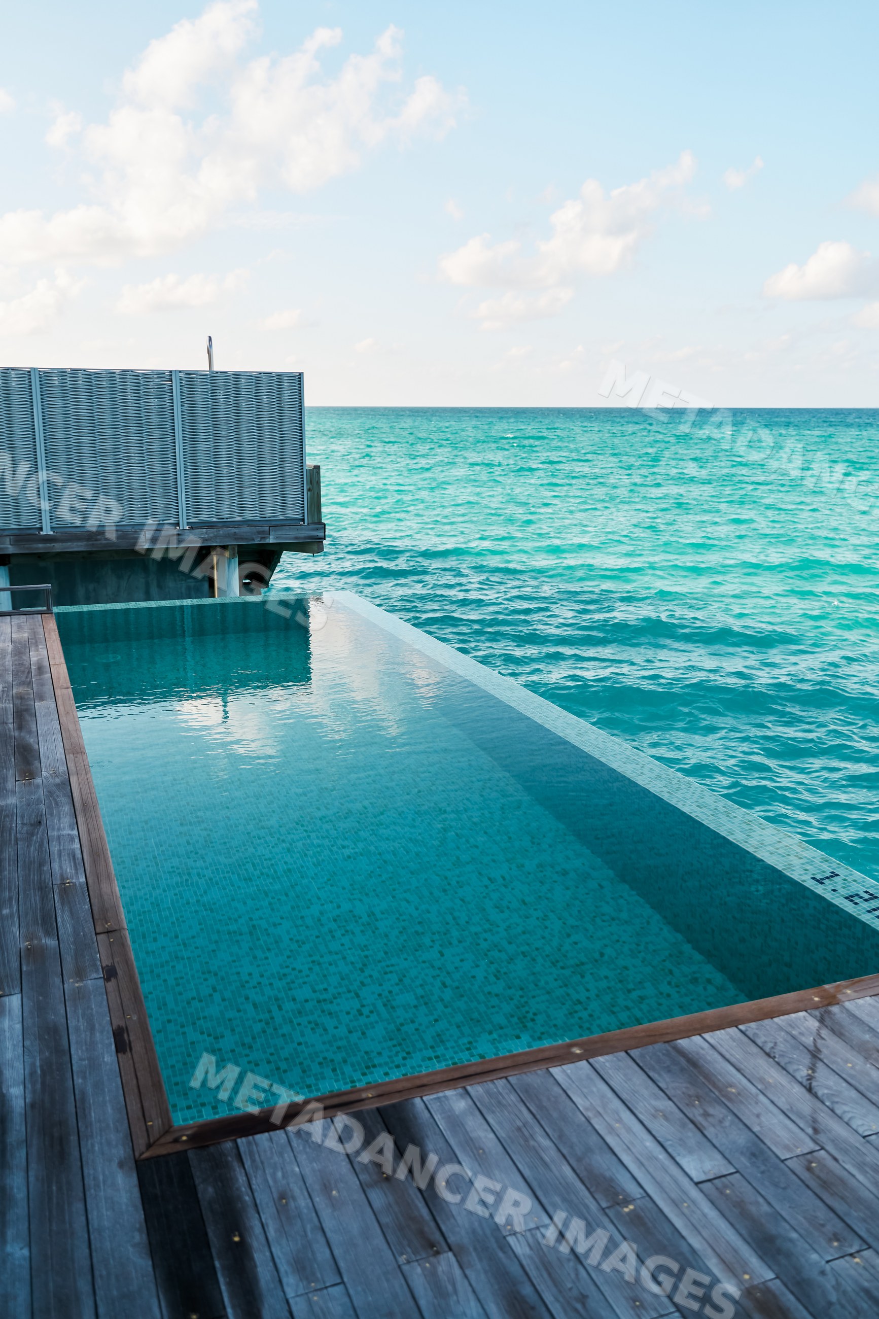 An infinity pool overlooking the turquoise ocean