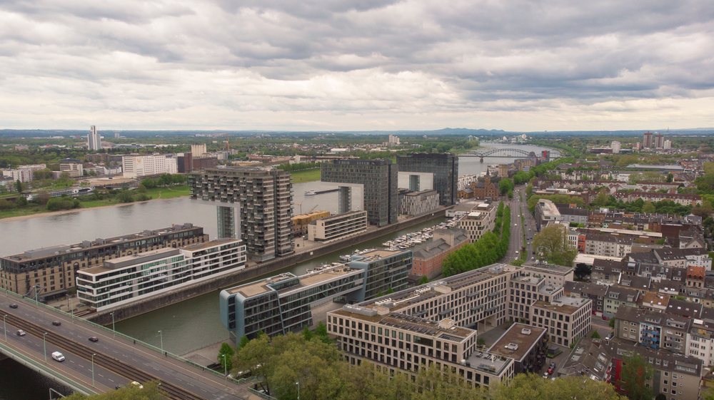 Modern buildings along River Rhine waterfront in Cologne's historic