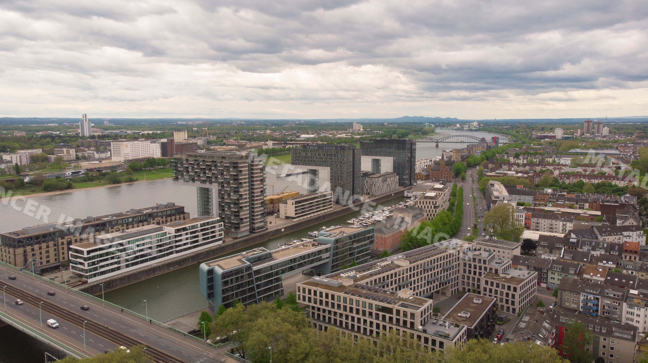 Modern buildings along River Rhine waterfront in Cologne's historic