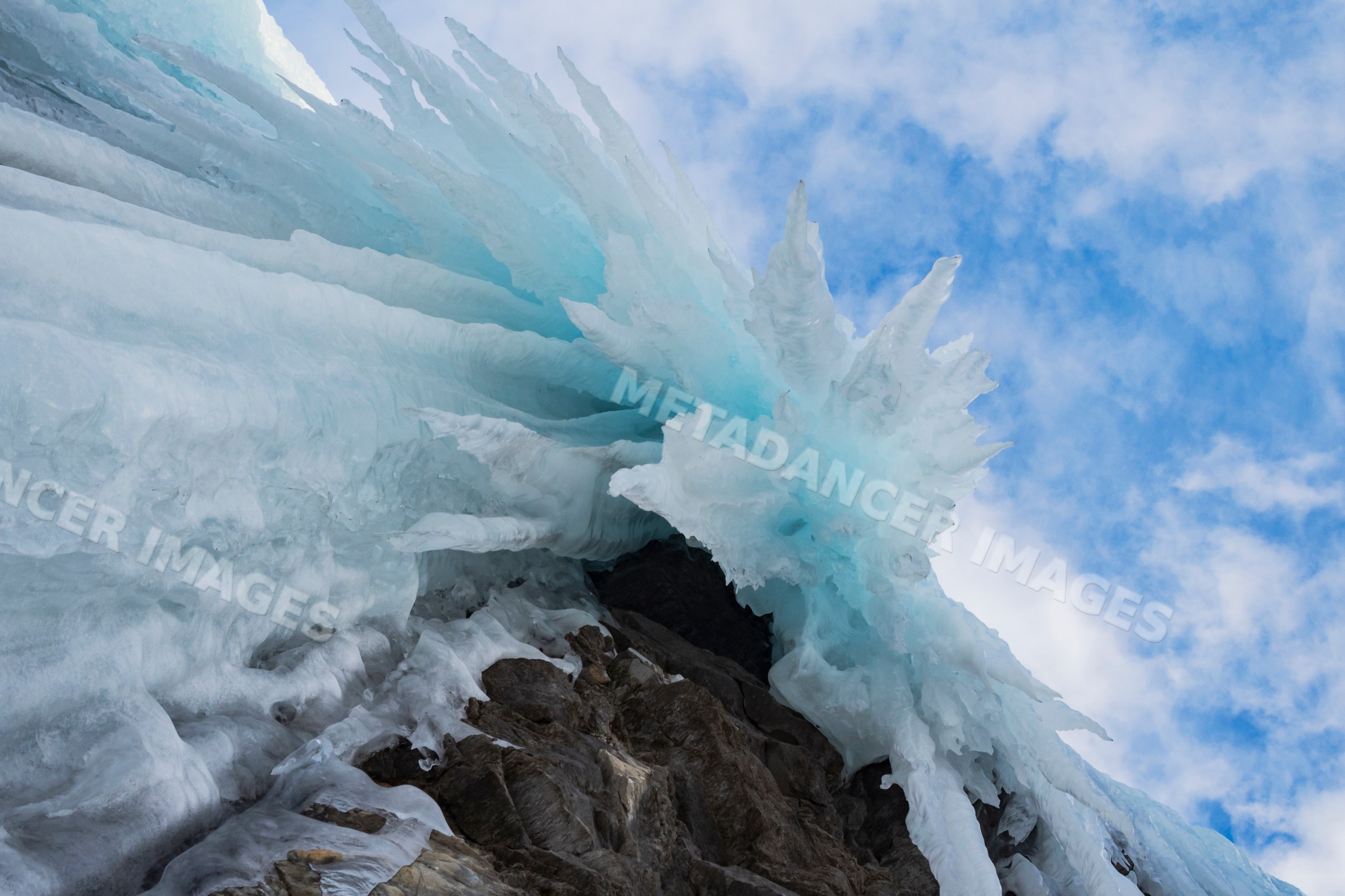 Frozen Waterfall with jagged ice formations below in nordkjosbotn