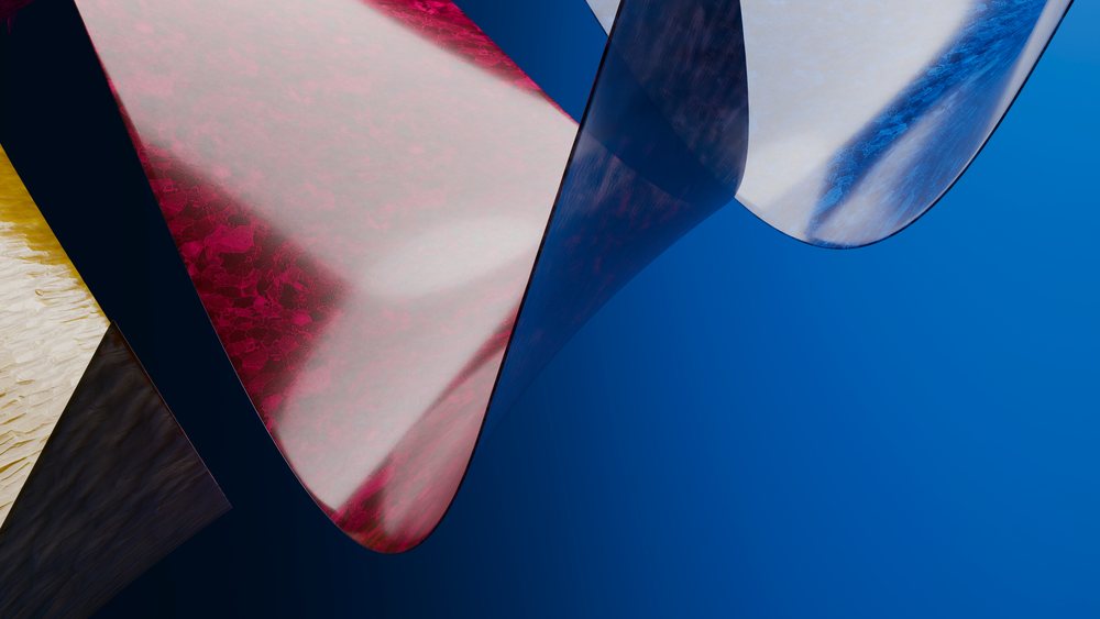 Abstract sculpture with curved colorful metallic surfaces