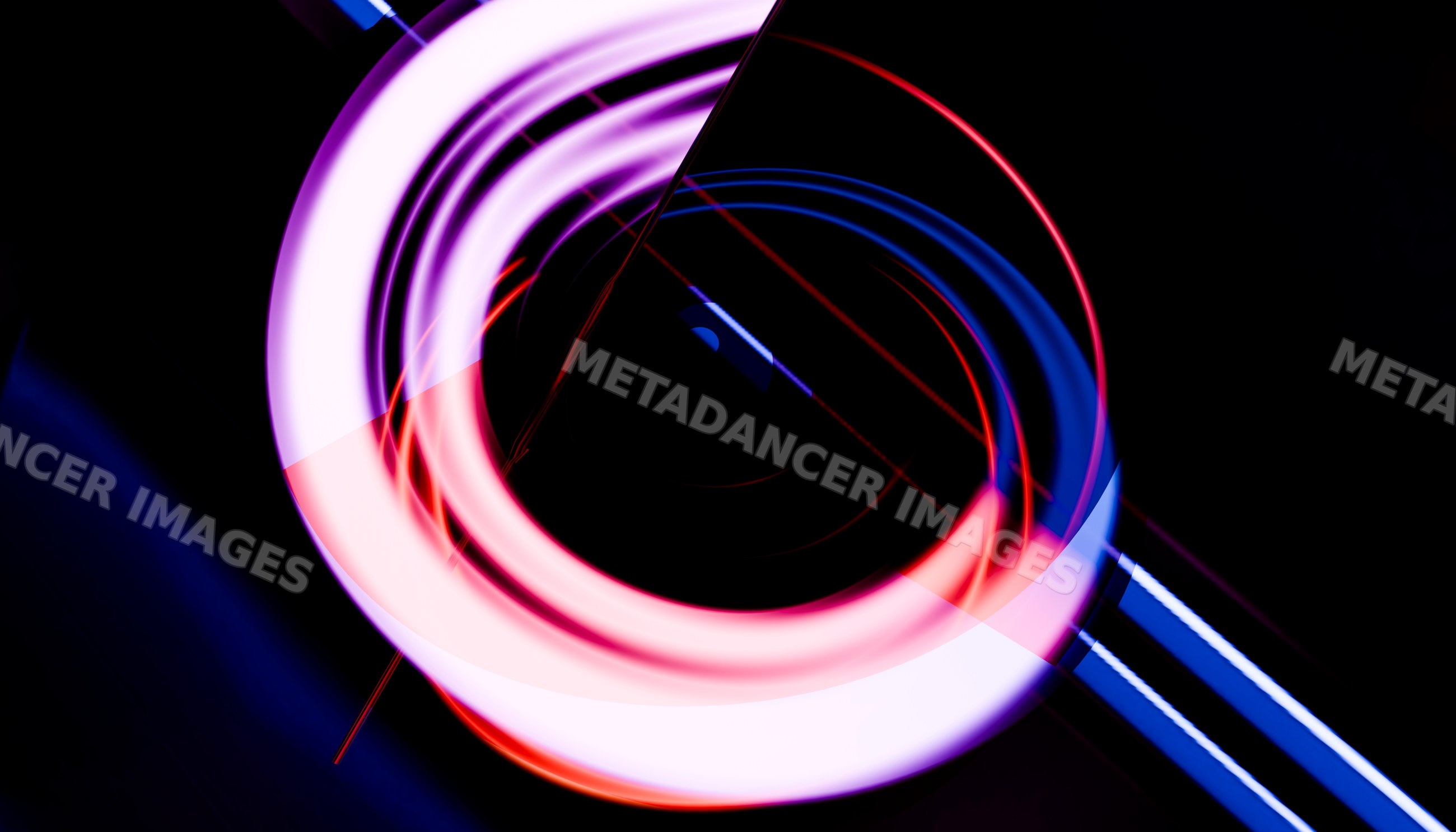 Colorful abstract circular light trails on dark background