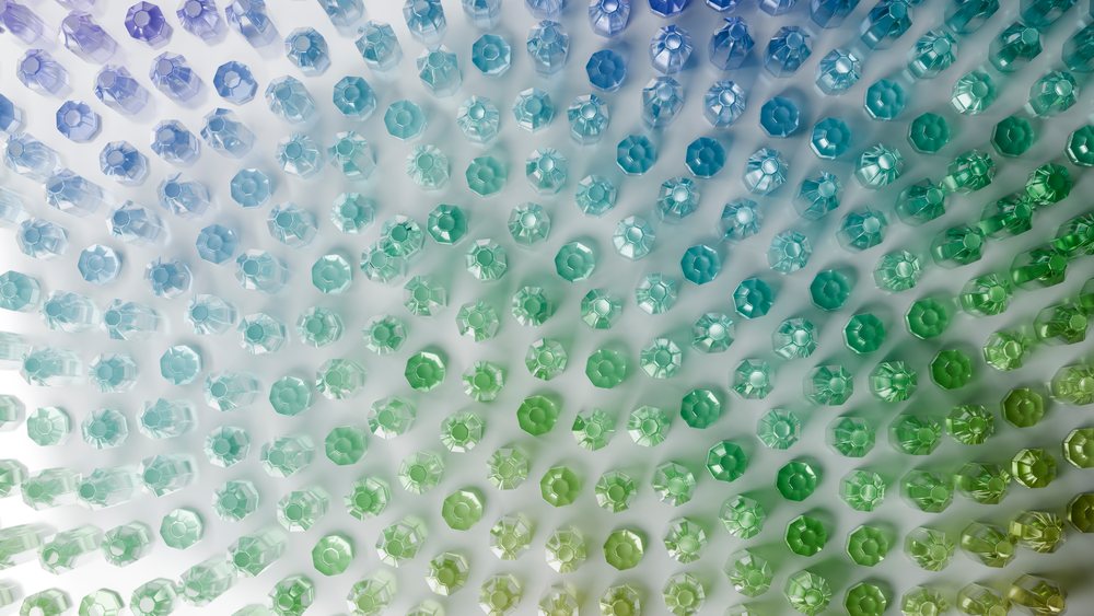 Circular gradient pattern of translucent glass bottles viewed