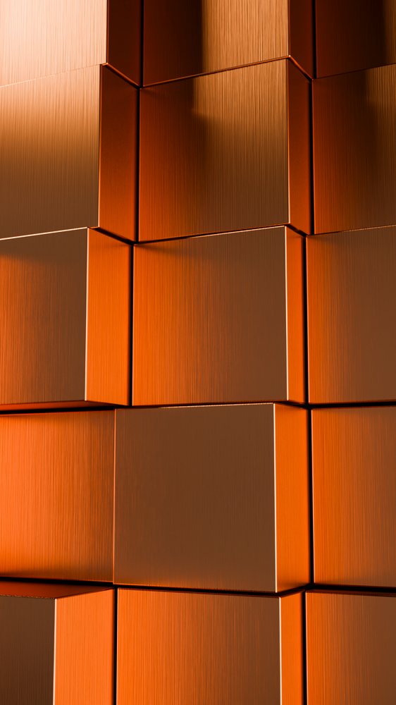 Stacked orange corrugated boxes with textured surfaces
