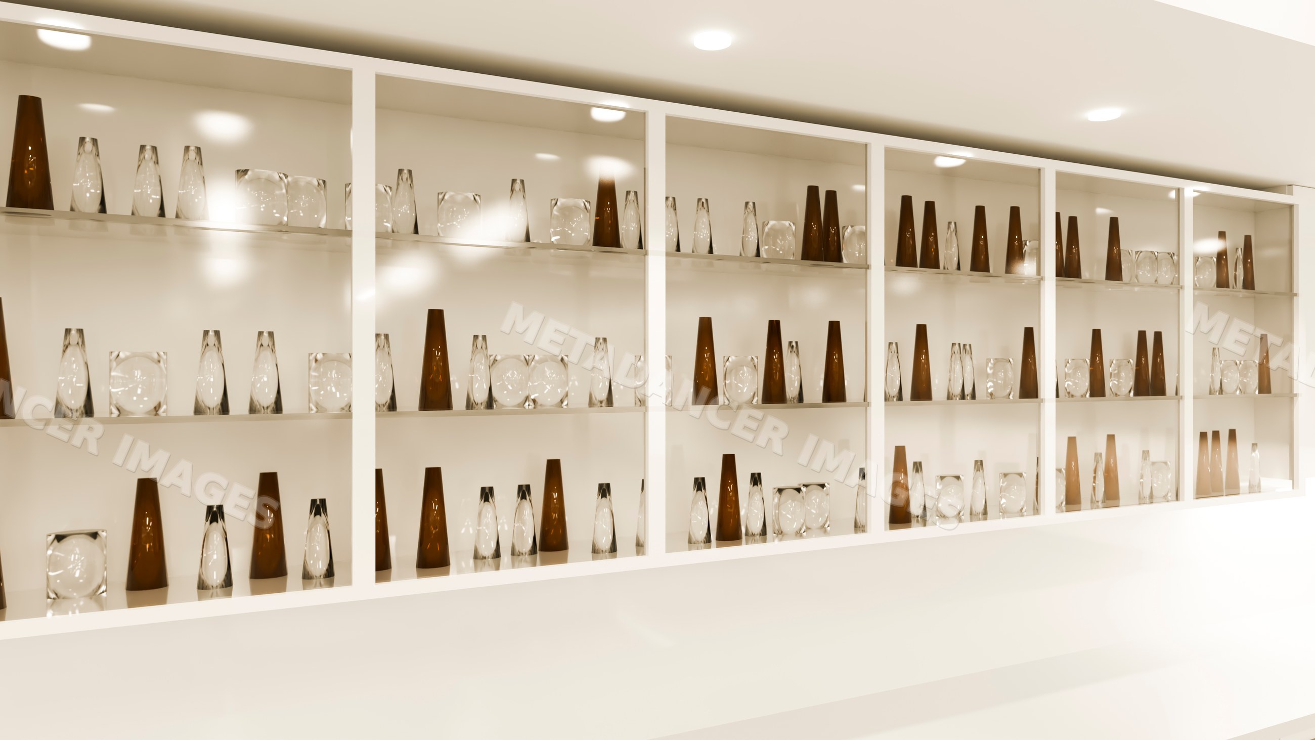 Glass and brown decorative vases arranged on white display shelf