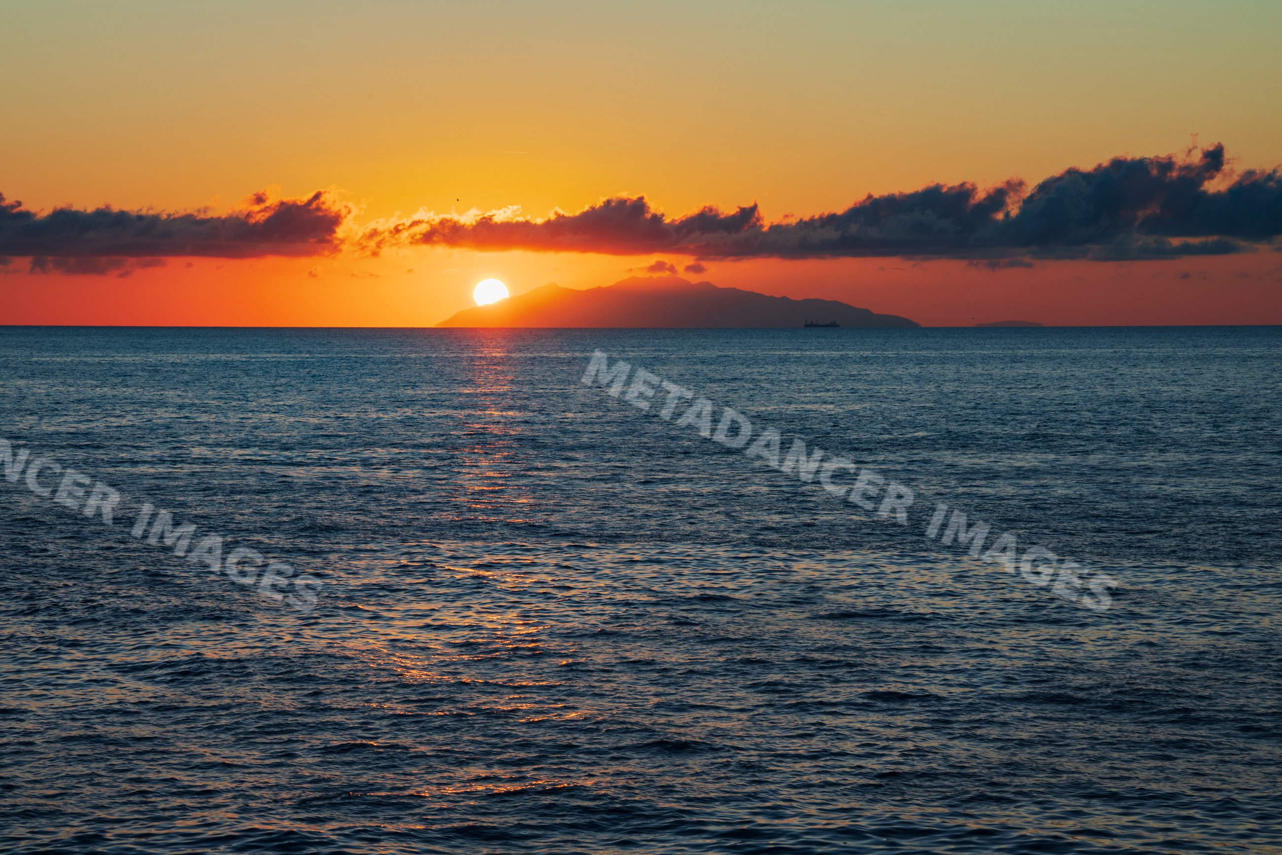 Sunrise over the Isle of Elba with sea and clouds