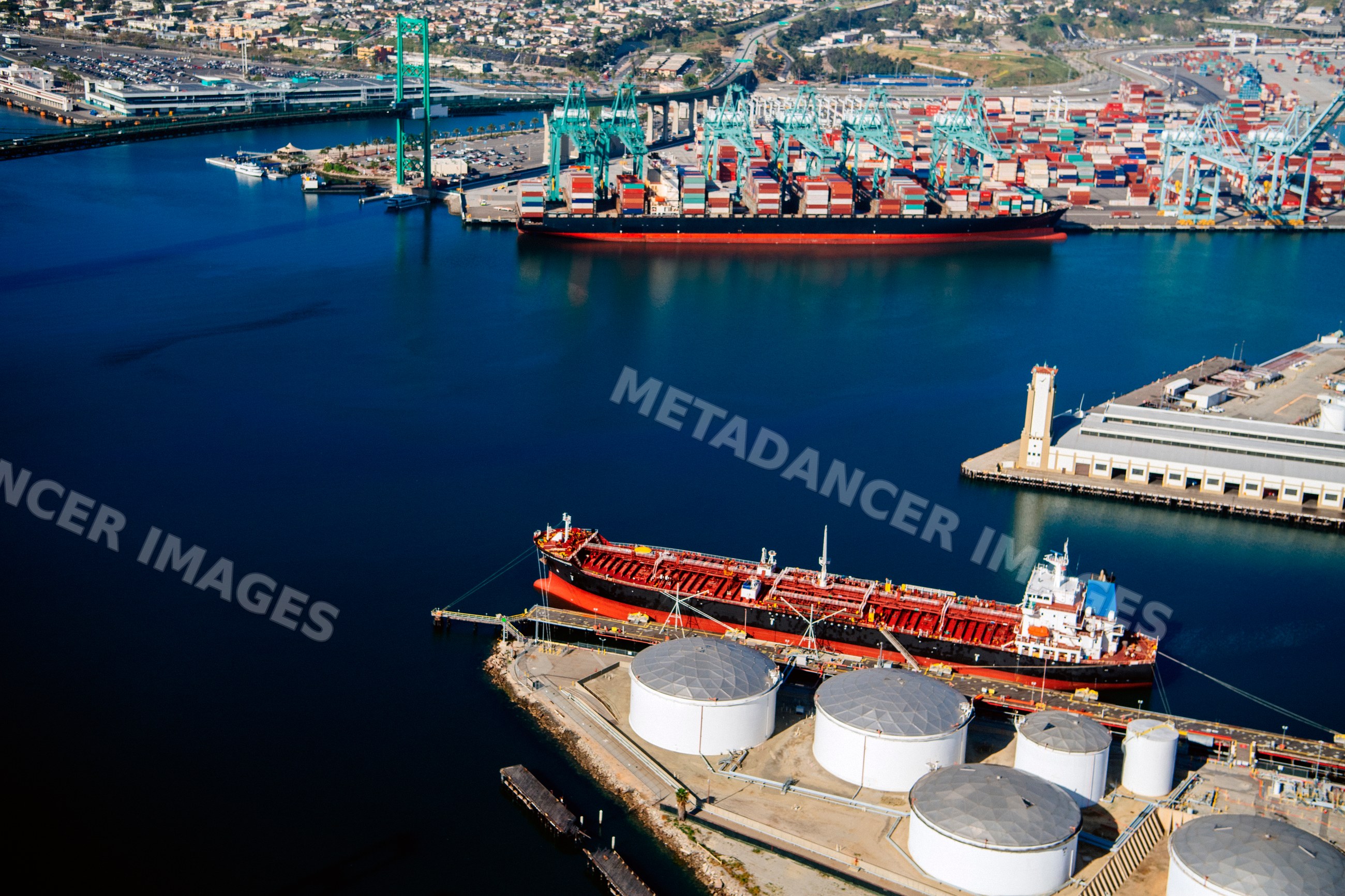 Container and oil tank ships docked at Port of Long Beach terminal
