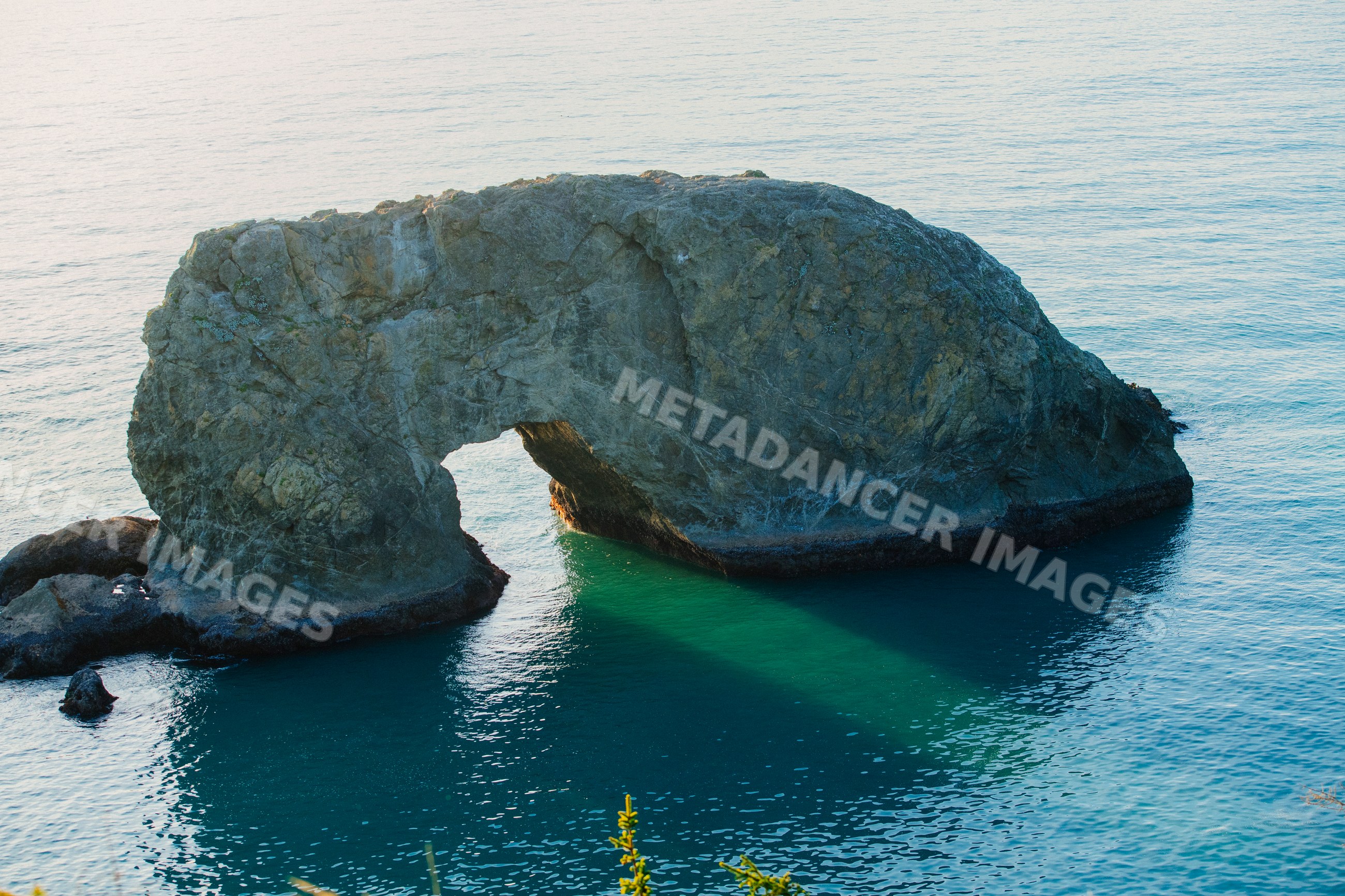 Natural rock arch in ocean Oregon