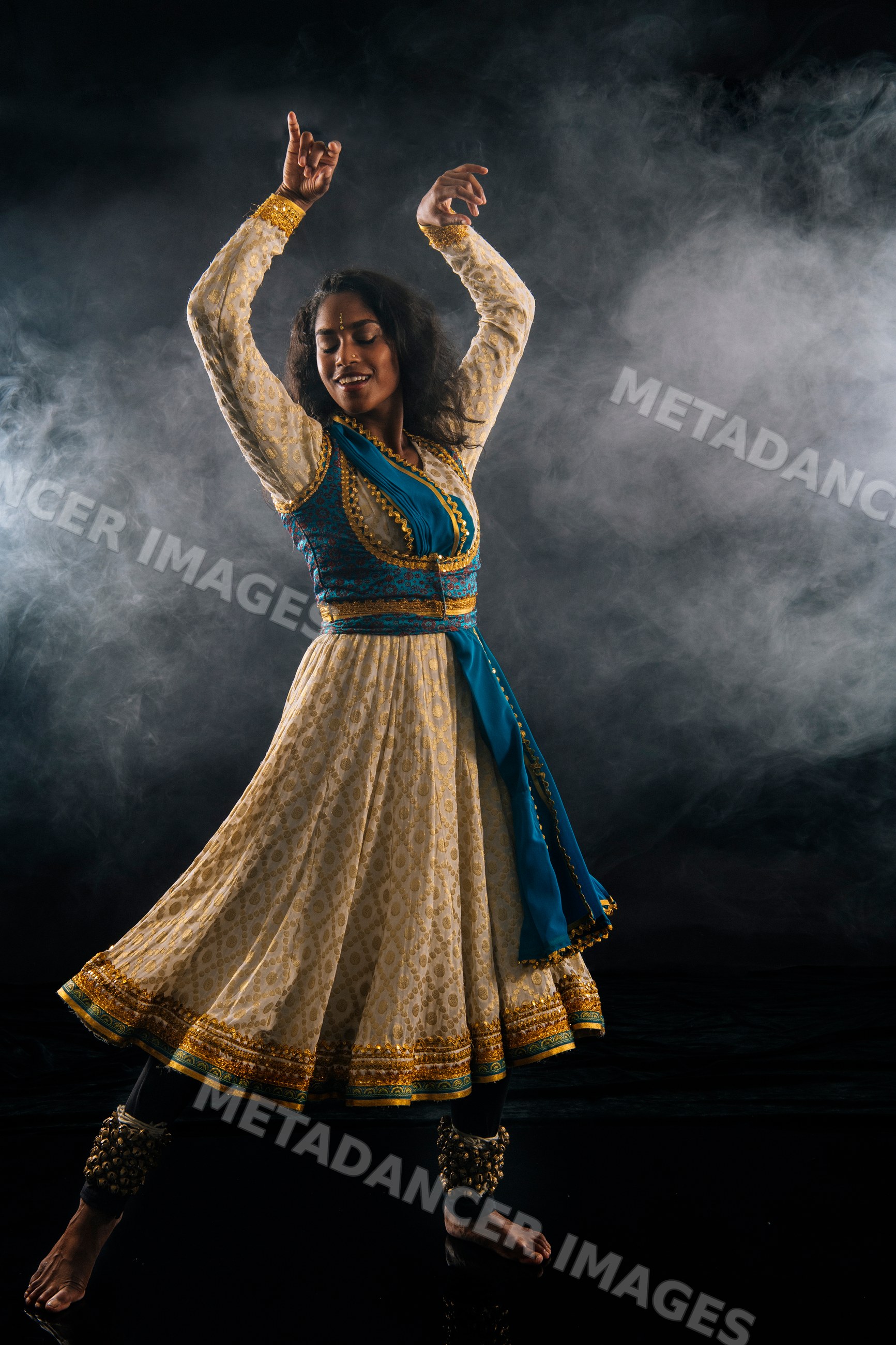 South Asian woman performs classical indian dance