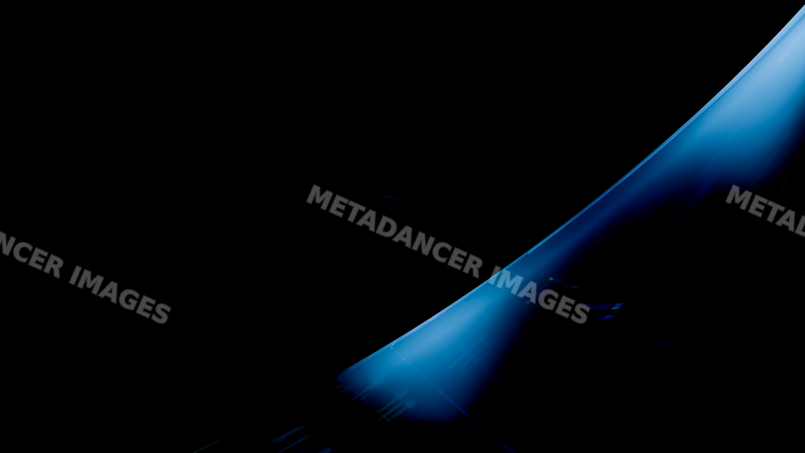 Stream of flowing blue water against black background