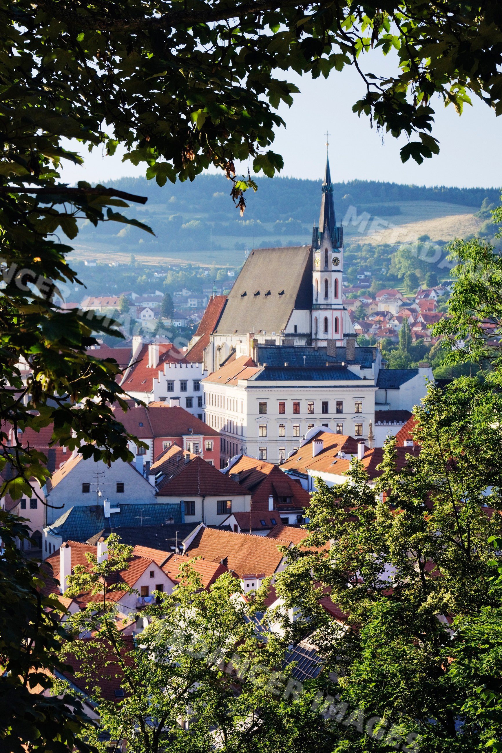 Historic church and rooftops of cesky krumlov town