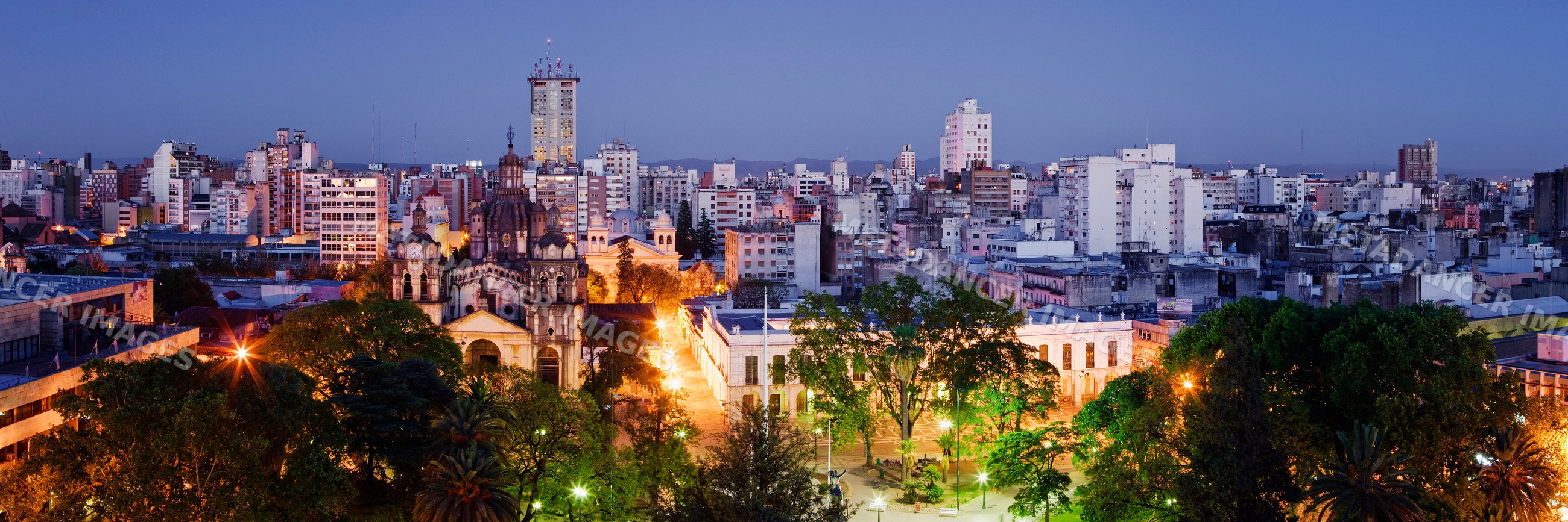 Cityscape of cordoba, argentina at dusk with illuminated buildings