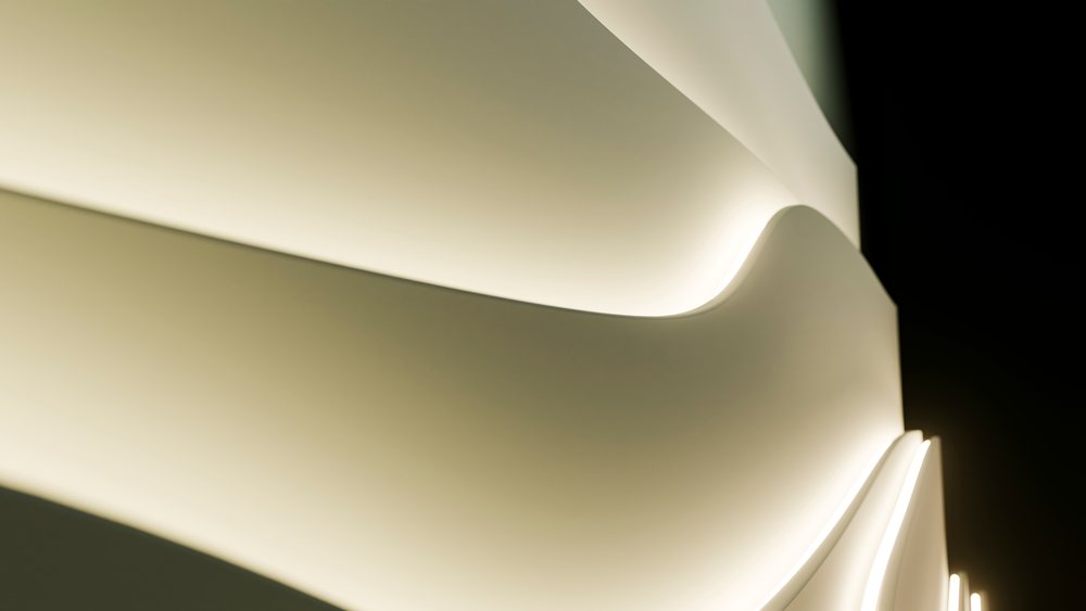 Curved abstract lines with soft white illumination on smooth surface