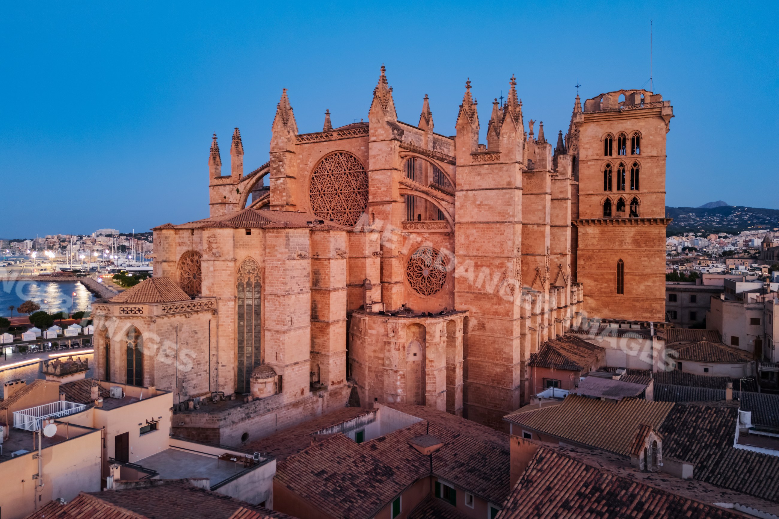 Cathedral in Palma de Mallorca at dusk with surrounding city