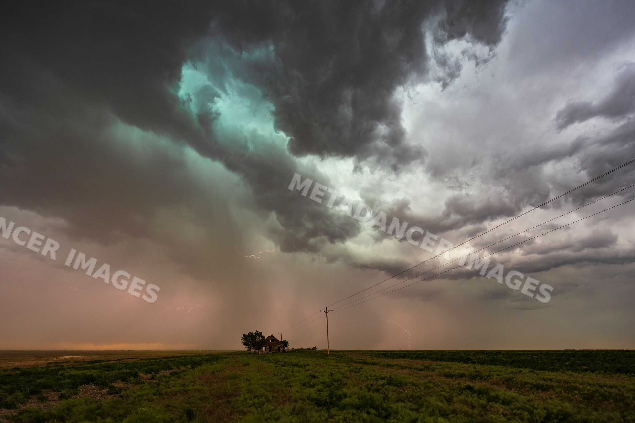 Abandoned House under storm clouds with lightning in haxtun, colorado