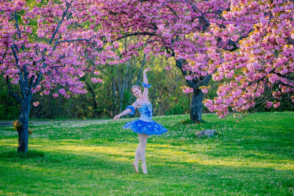 Ballerina in blue tutu dances gracefully