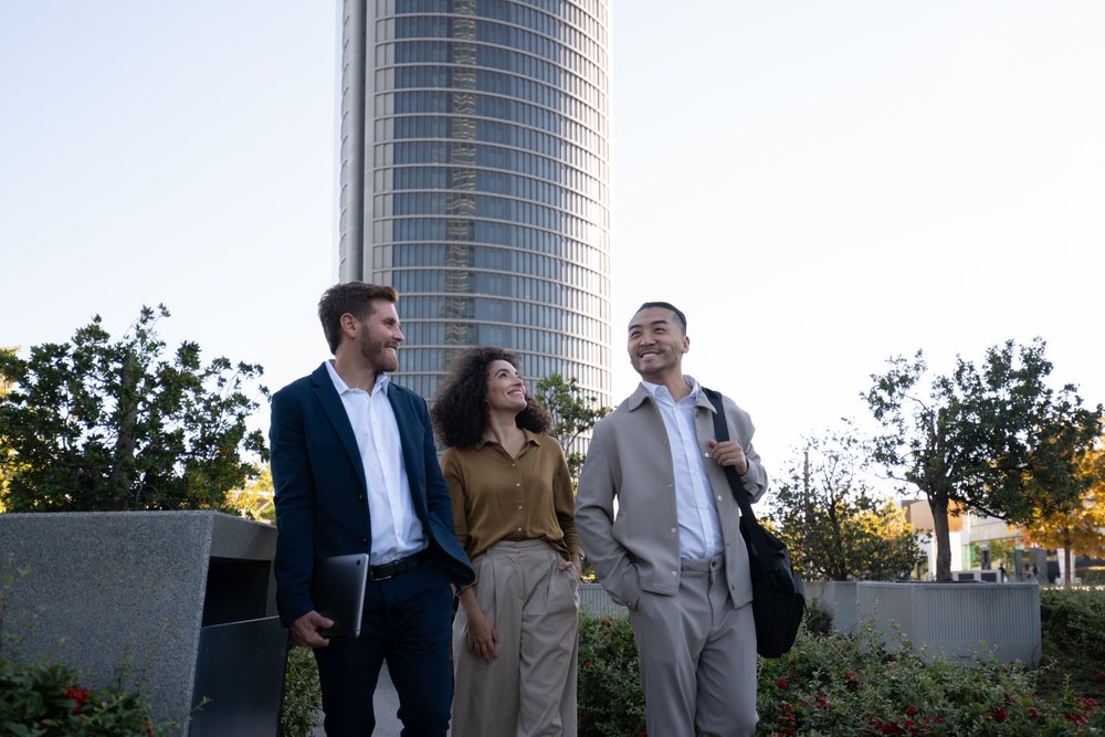 Diverse business group walking and talking in urban park in Madrid