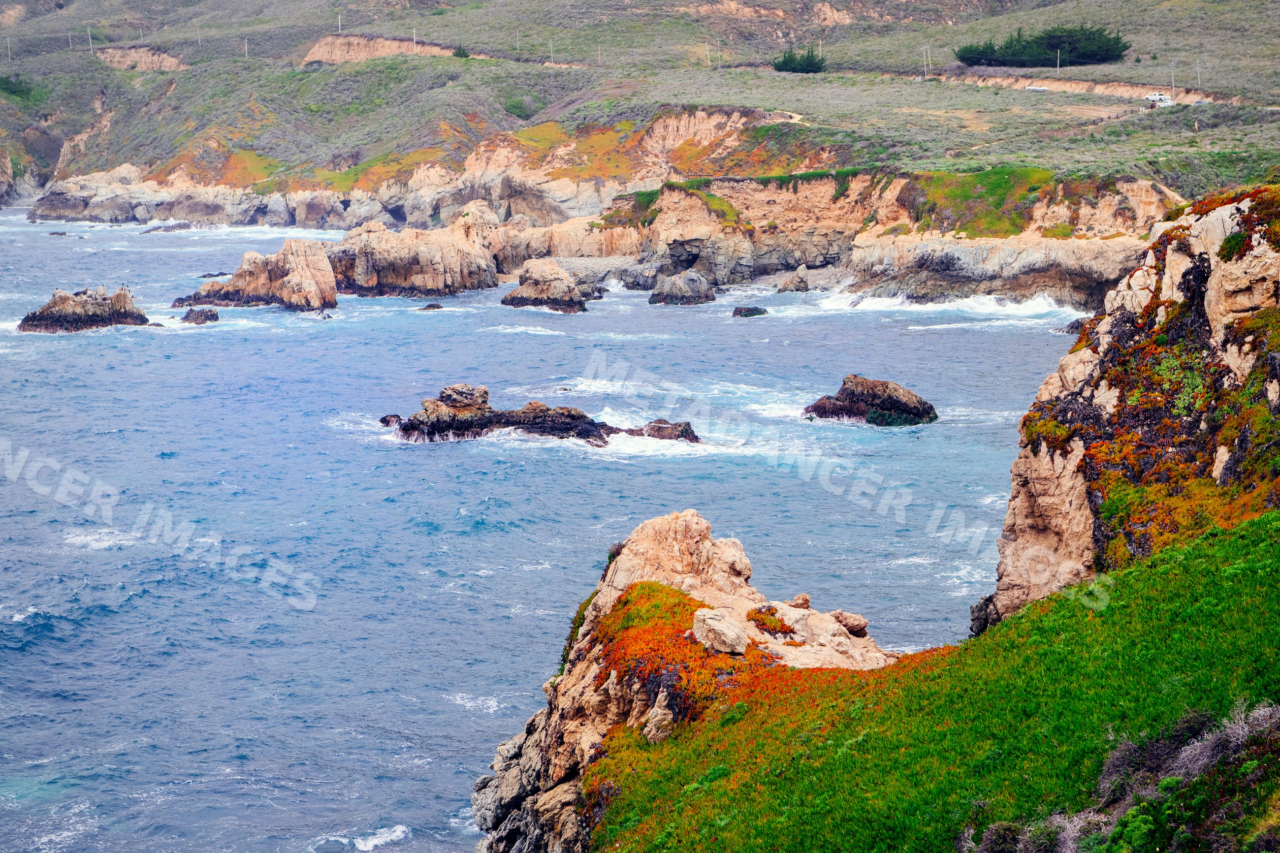 Rocky California coastline with ocean waves and coastal cliffs
