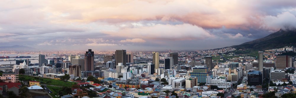 Cape town city skyline with harbor and mountains at sunset