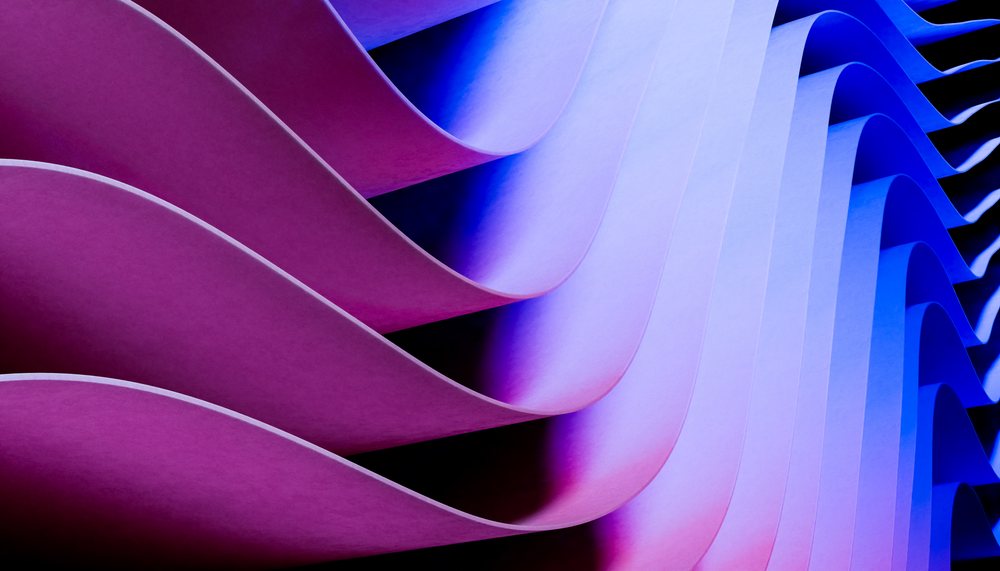 Abstract background of purple and blue curved wave pattern