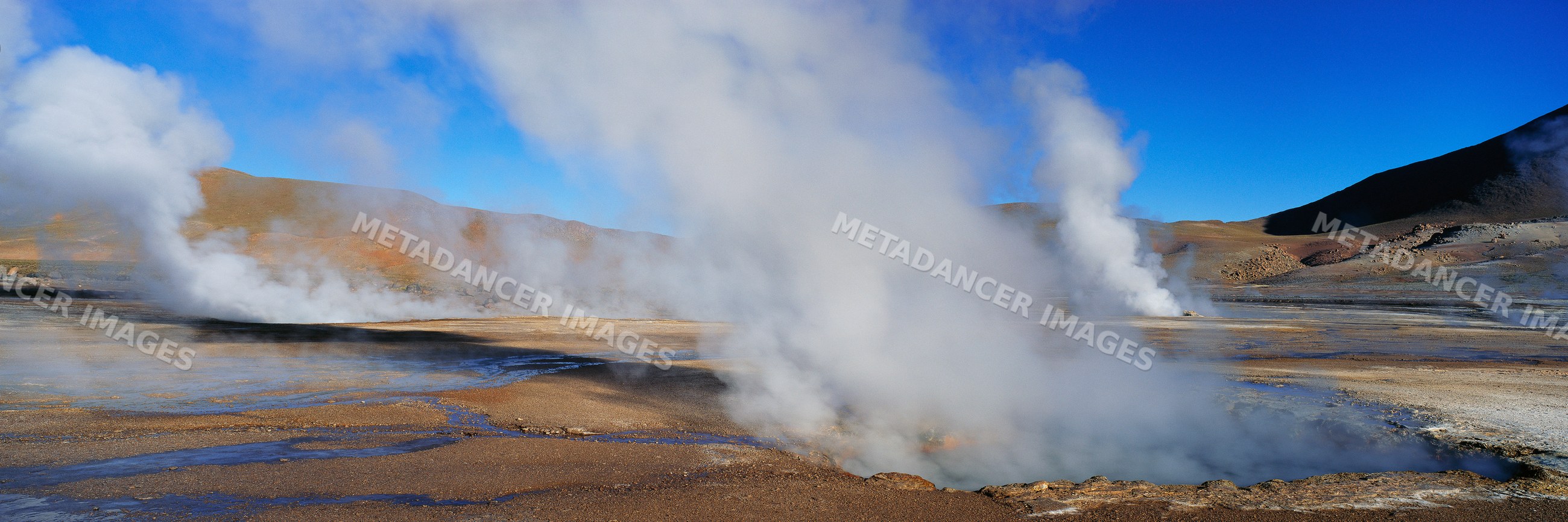 El tatio geysers steaming in atacama desert chile landscape