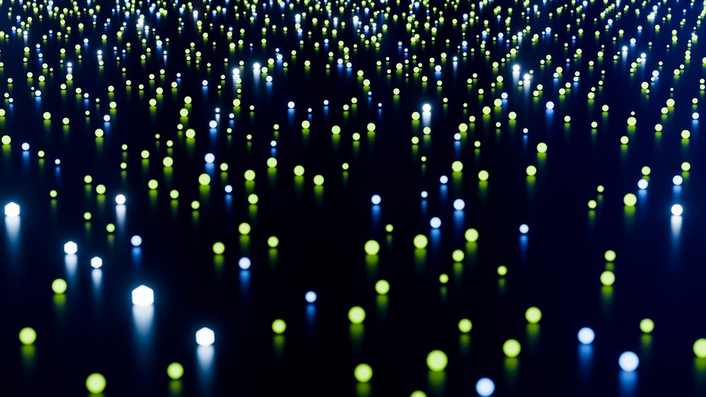 Glowing blue and green light spheres on reflective dark surface