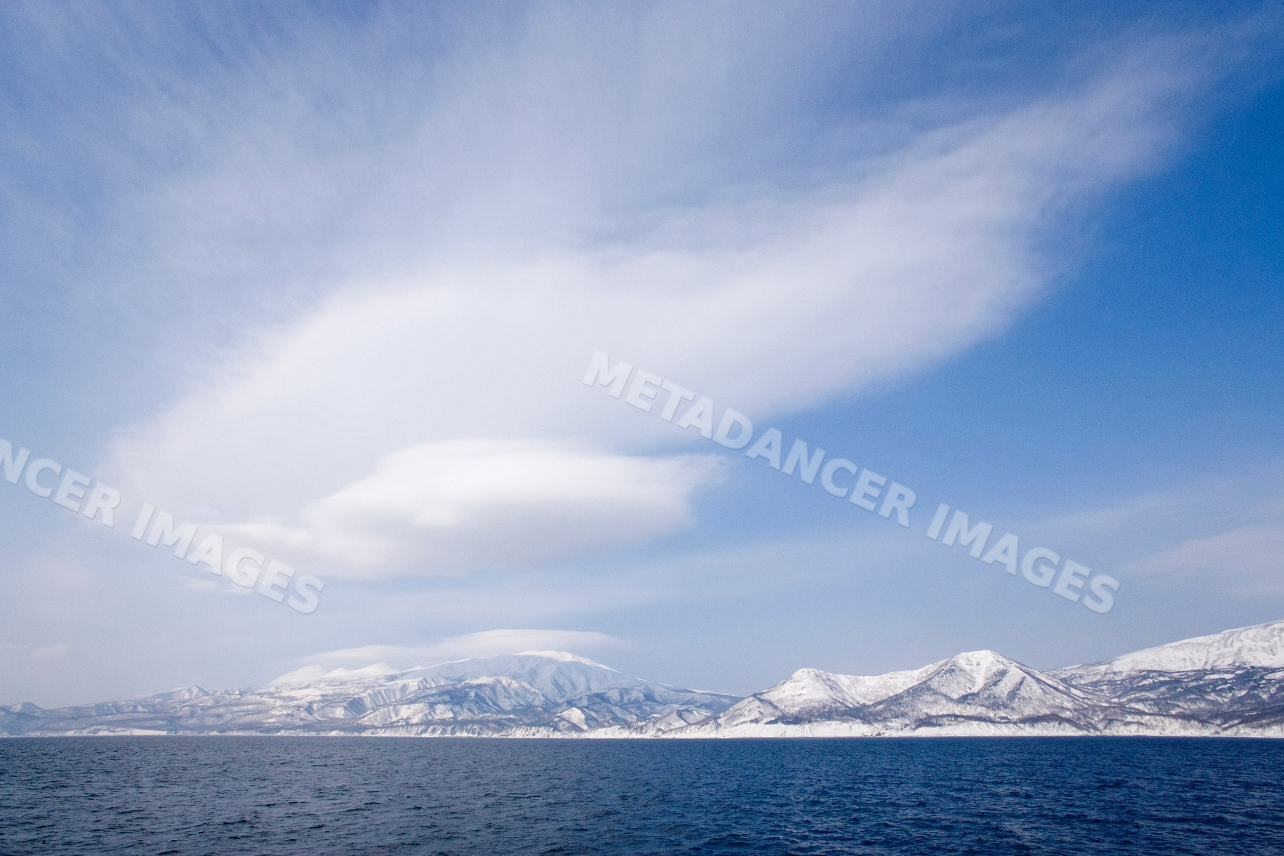 Snow-covered shiretoko peninsula with sea and clouds japan