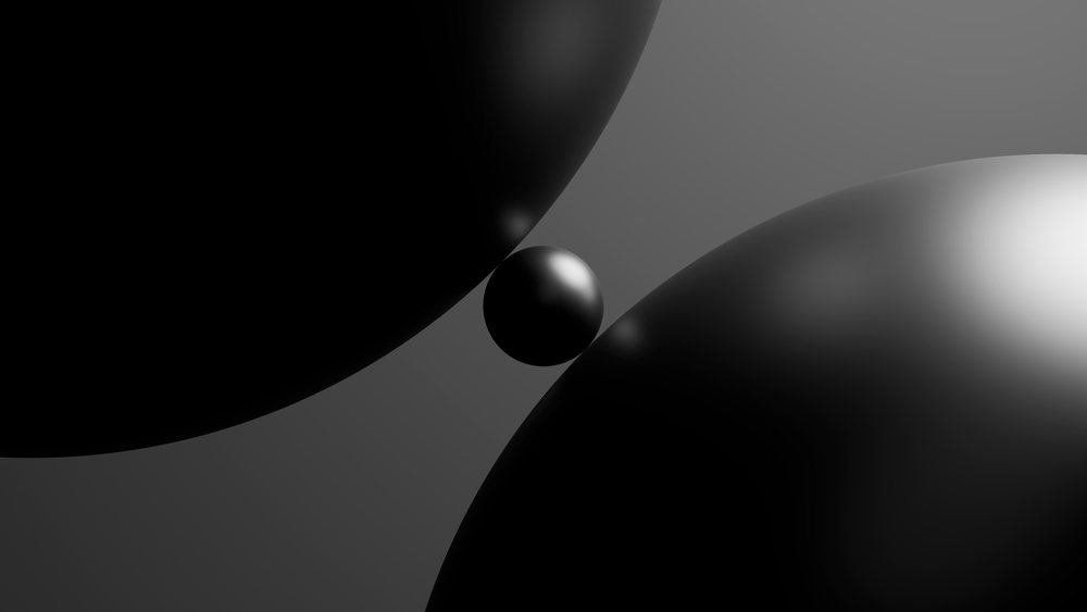 Three black glossy spheres in abstract 3d digital illustration