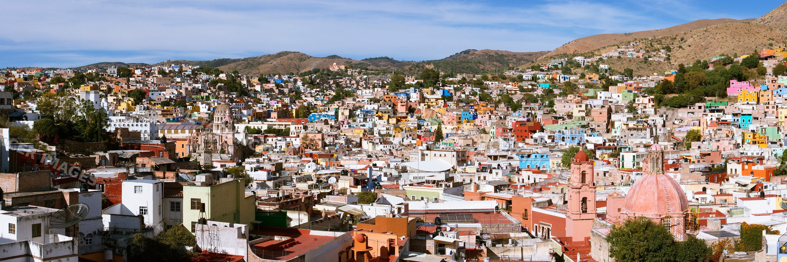 Panoramic cityscape of colorful guanajuato buildings and hills