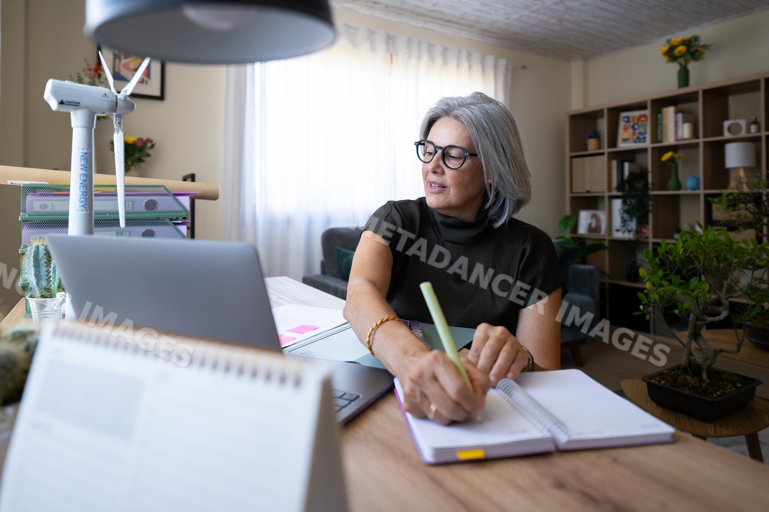 White woman writing notes