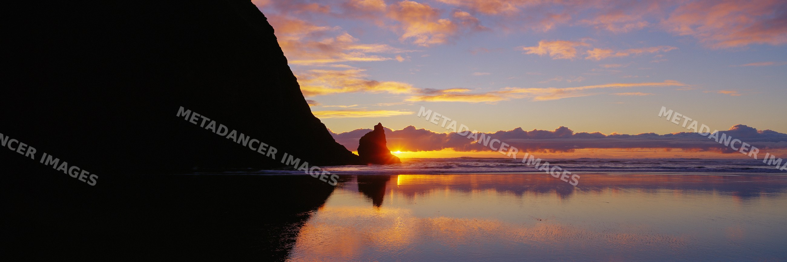 Haystack rock sunset reflection
