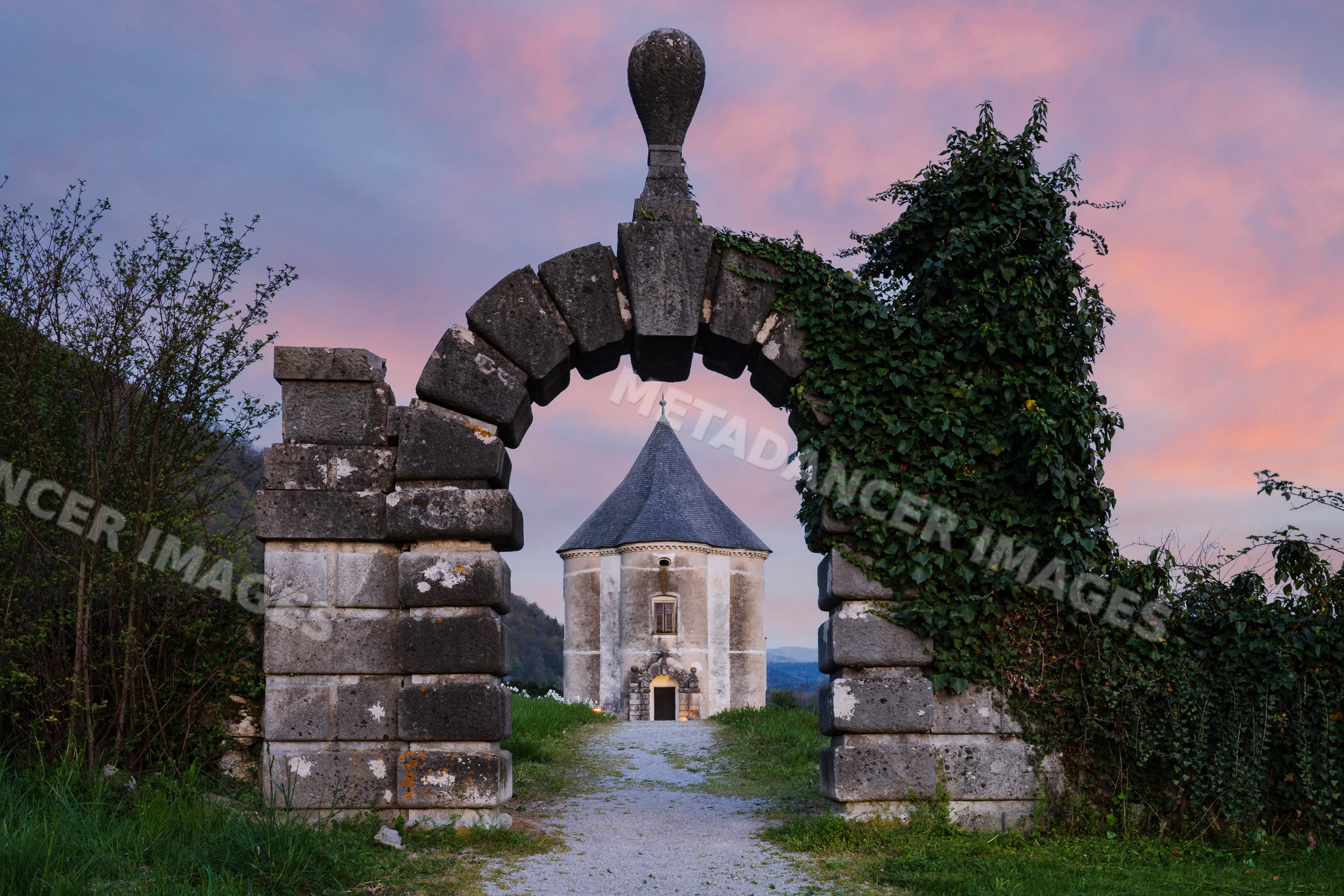Hudičev turn historic tower framed by stone arch