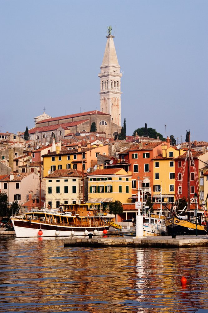 Harbor view with boats and church tower, croatia